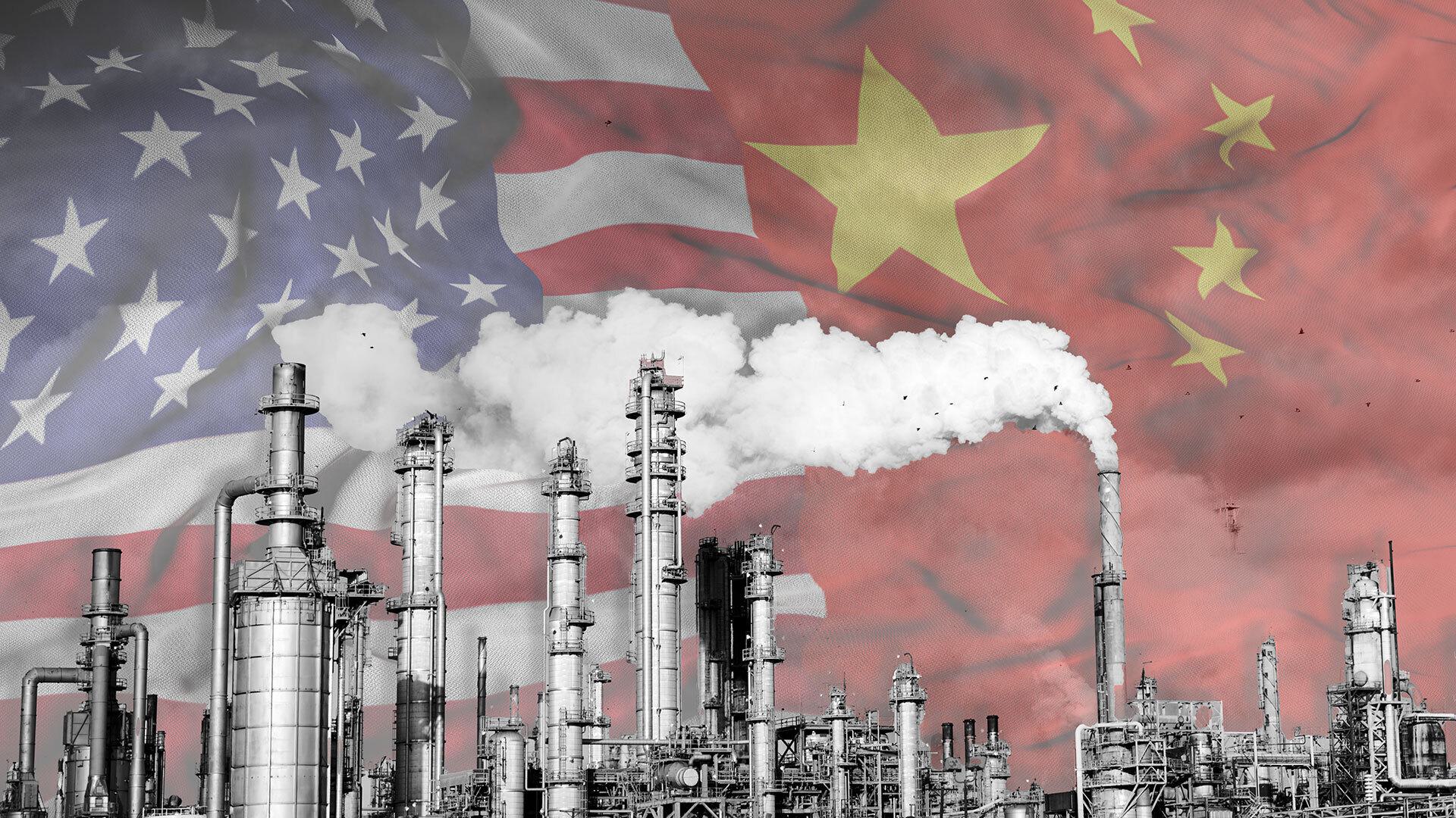 smoke stacks with American and Chinese flags in background