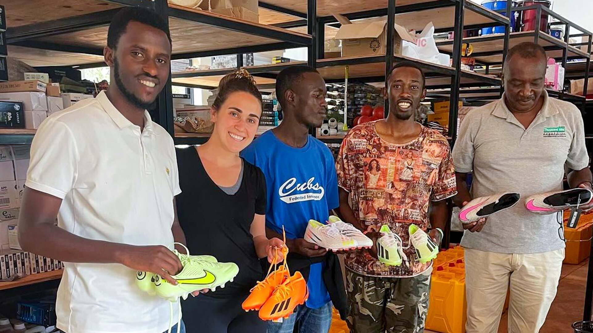 Sara giving cleats to Agahozo Shalom Youth Village in Uganda 1920x1080