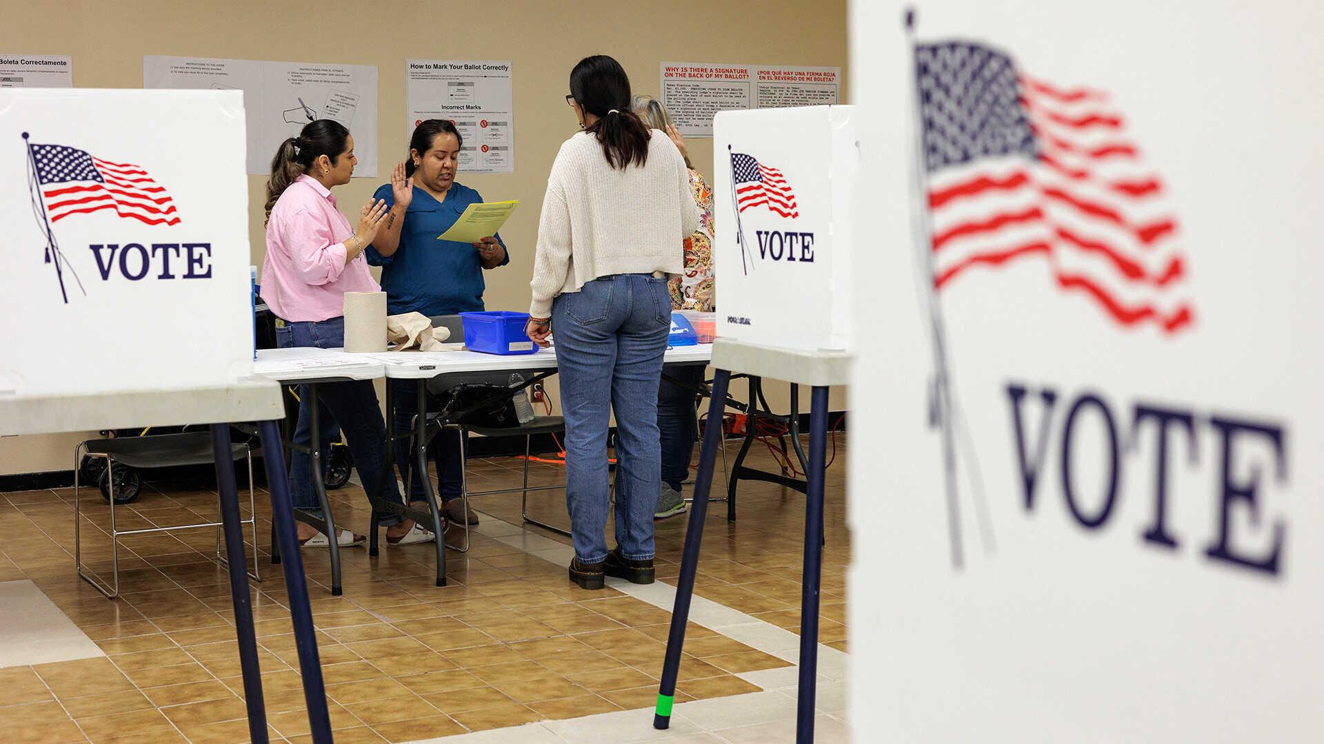 poll workeres take oaths