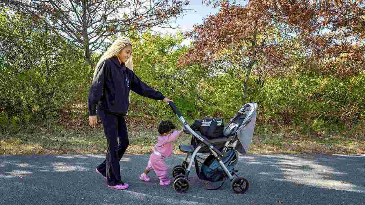 Amaya Johnson and young daughter push stroller