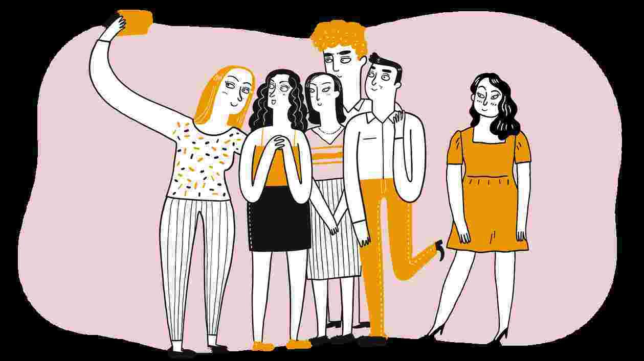 group of friends gathers to take selfie