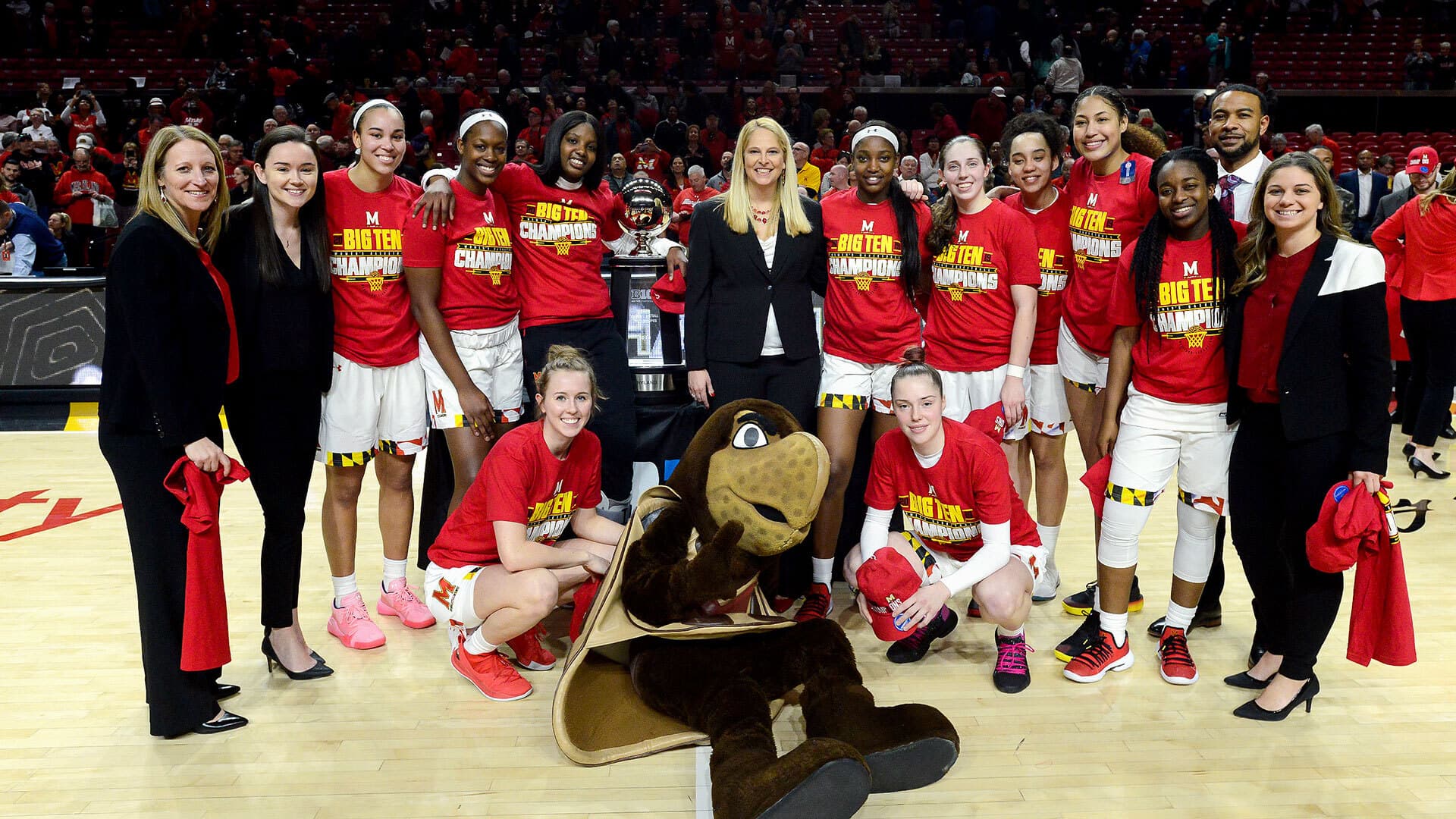 Women's basketball team with trophy