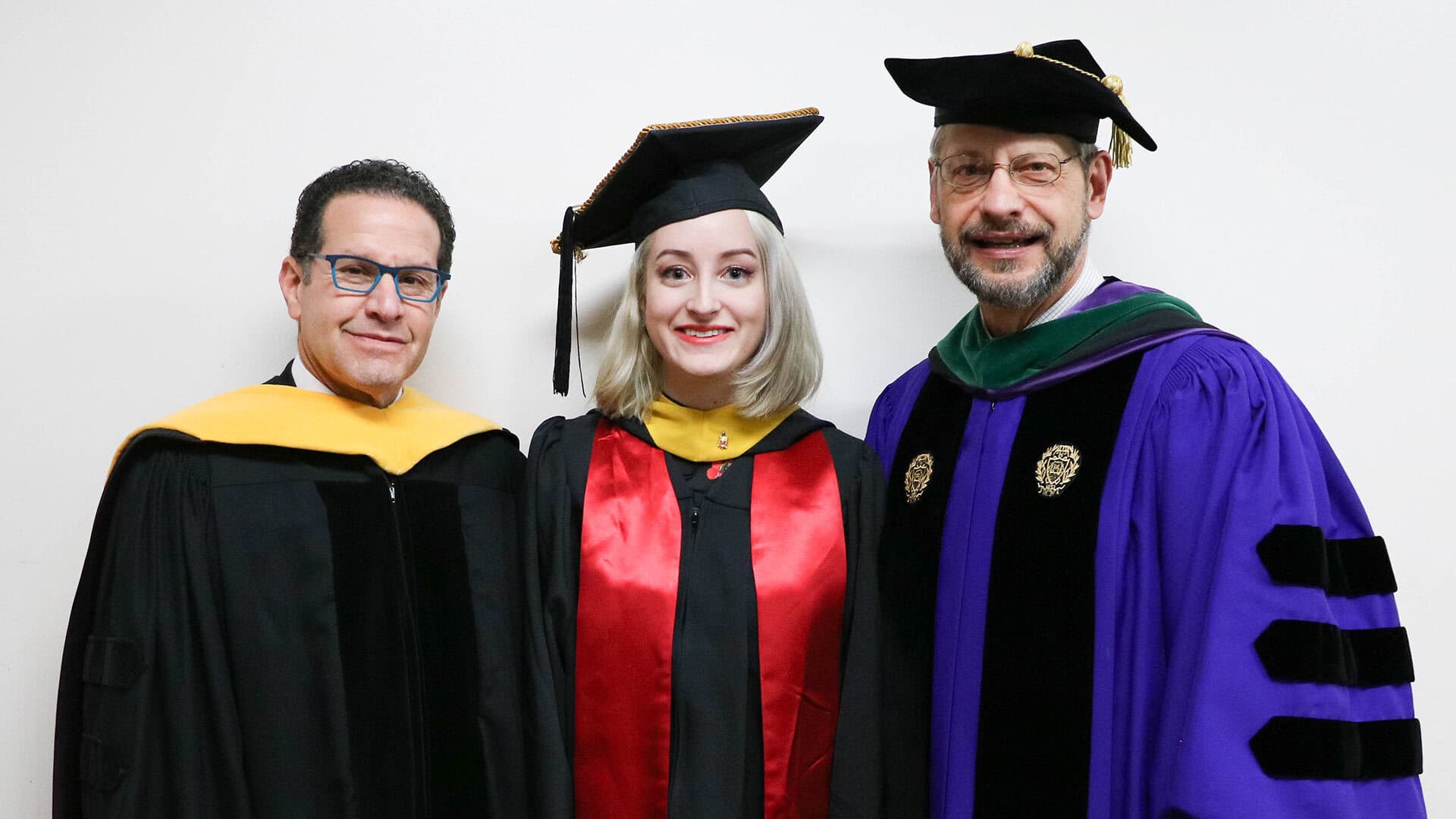 Neil Meltzer stands with student speaker Mina Griffioen and SPH Dean Dr. Boris Lushniak at the fall 2018 SPH commencement ceremony.