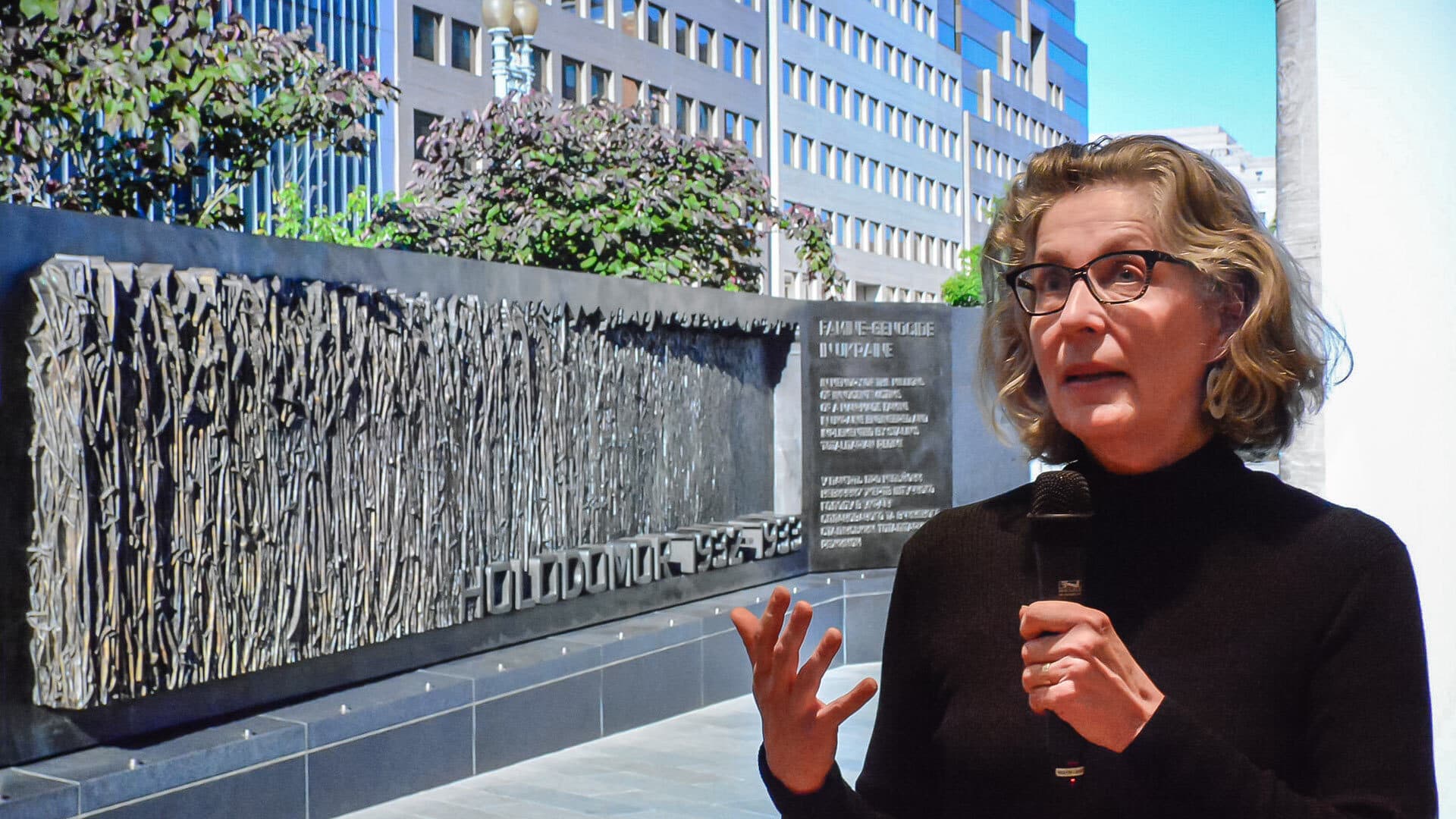 Larysa Kurylas ’80 talks in front of Holodomor memorial