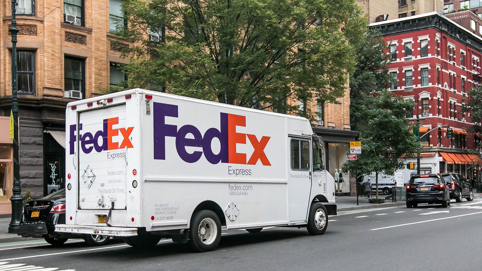 FedEx truck on city street