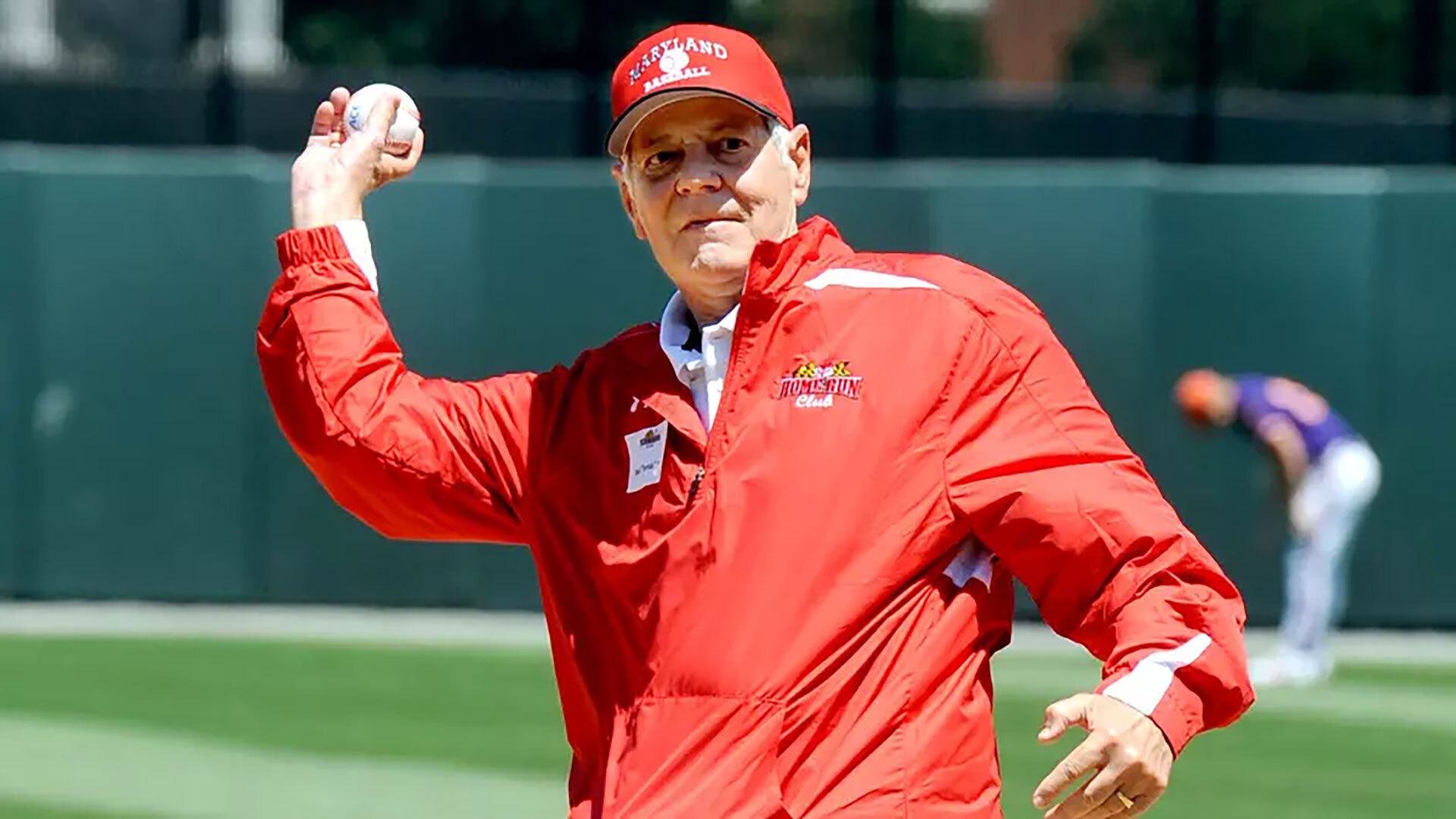 Man throws ceremonial first pitch at baseball game