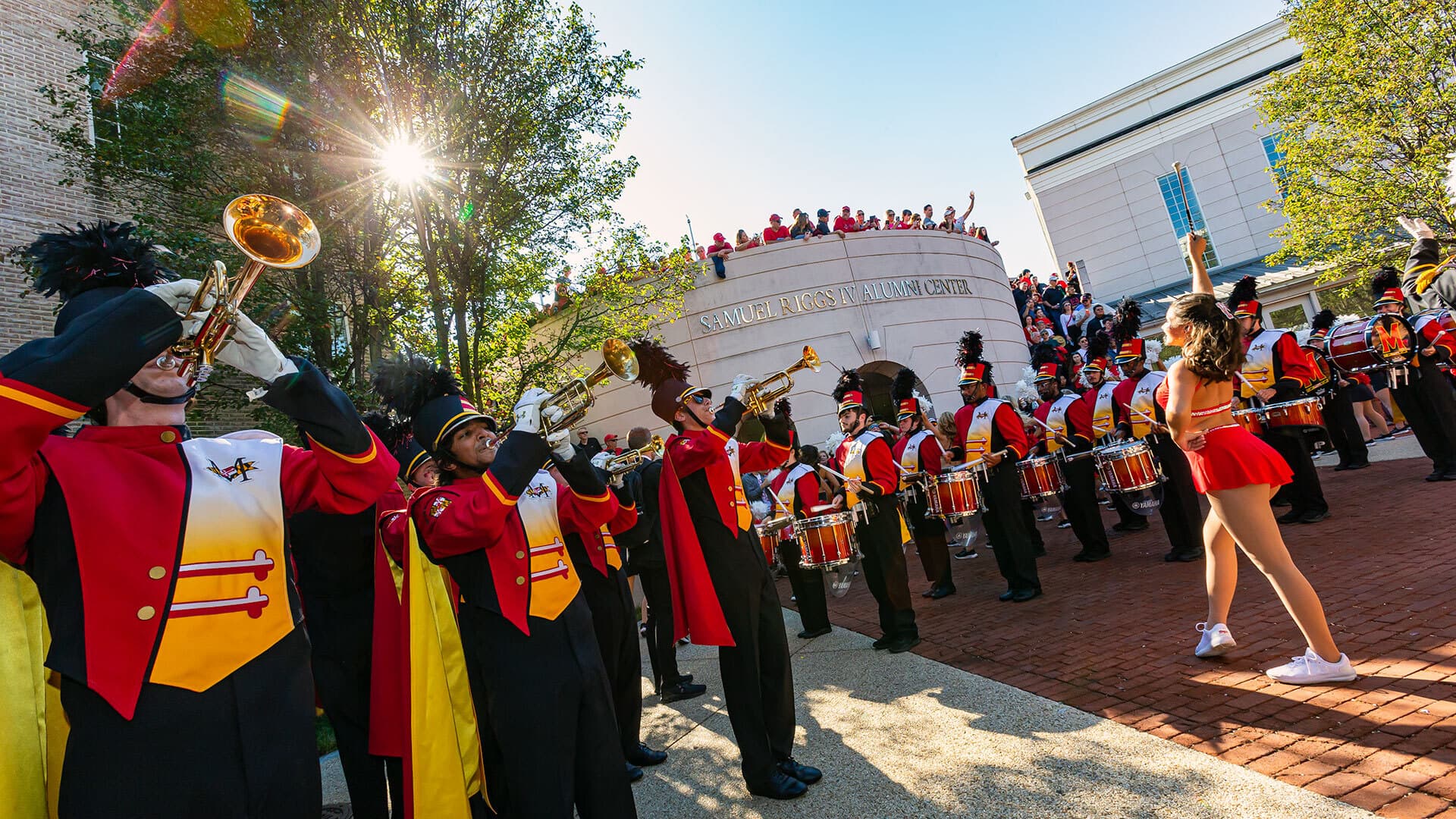 Marching band plays in front of Samuel Riggs IV Alumni Center