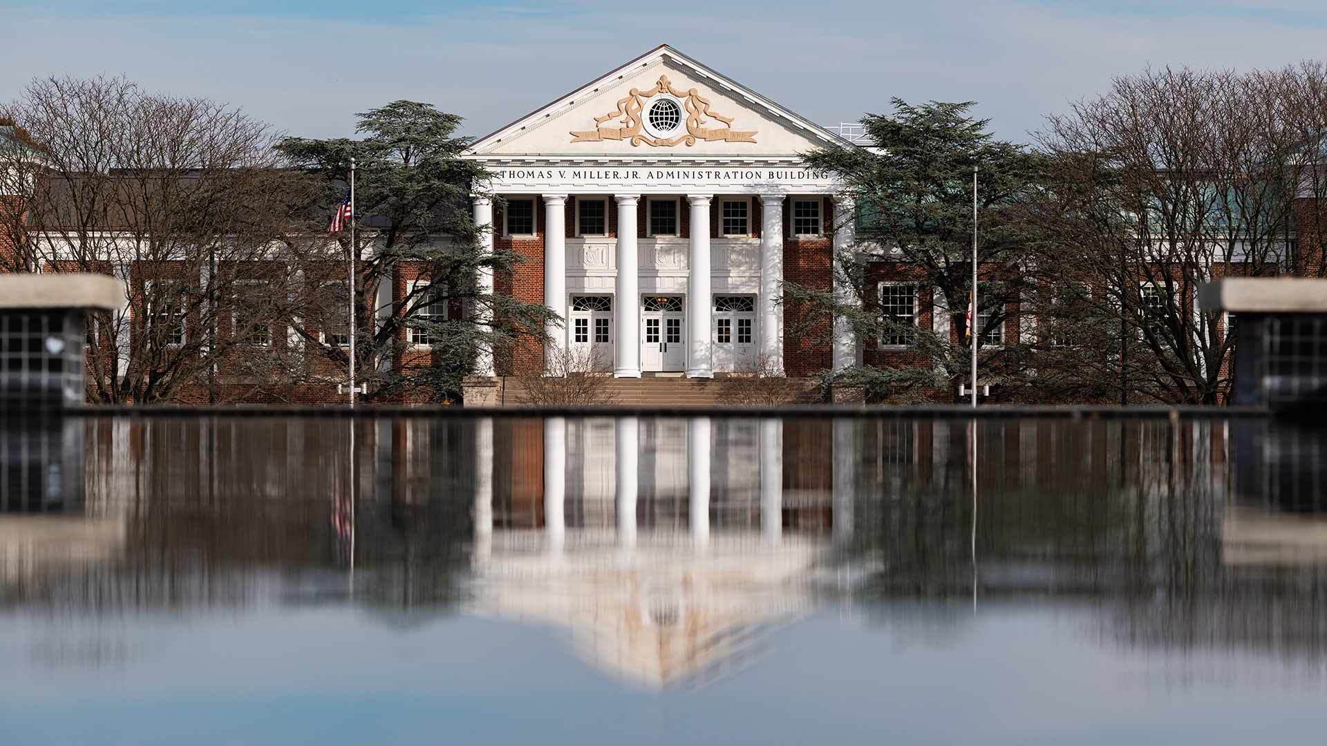 Main admin building reflected in fountain