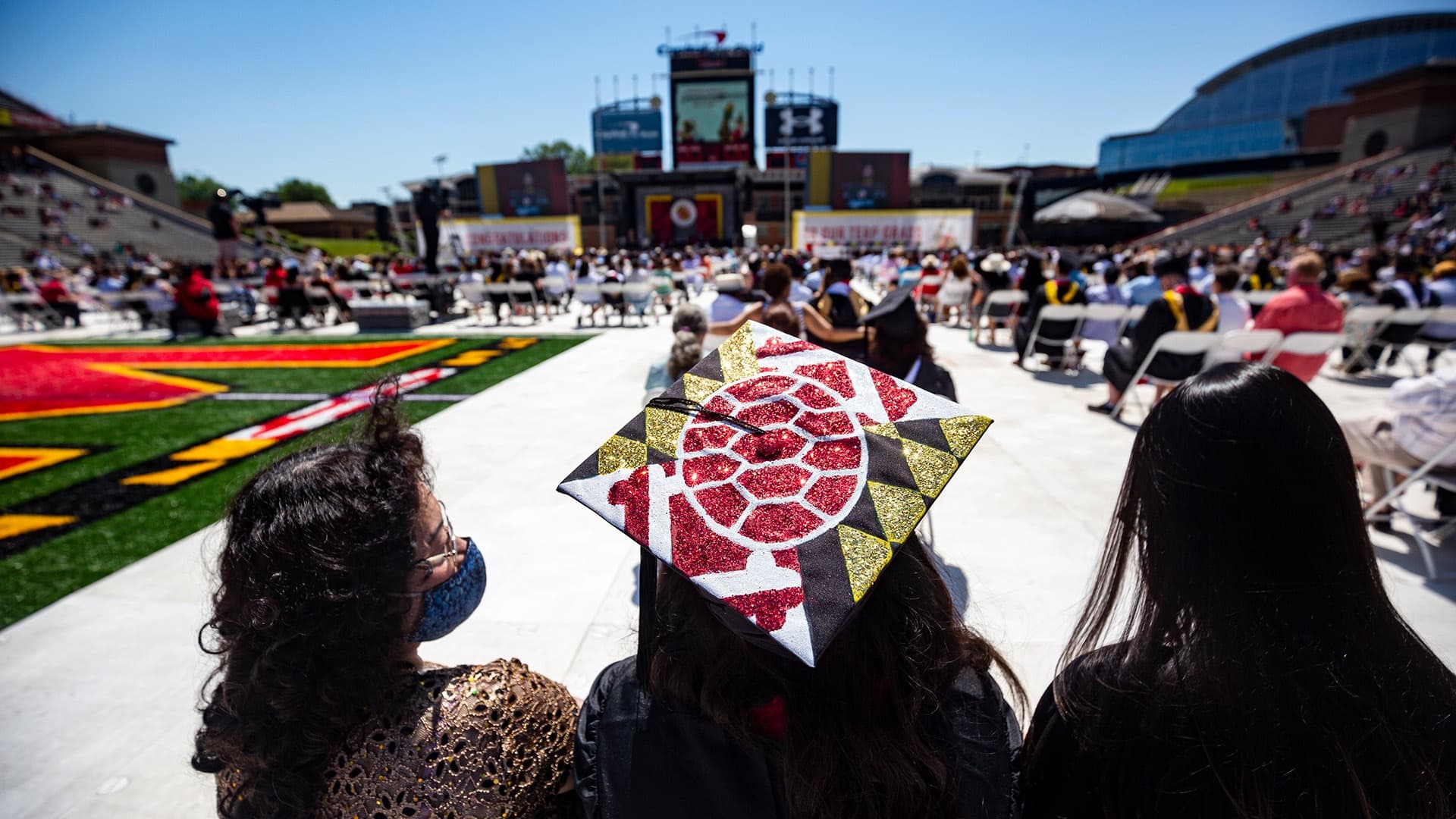 Decorated grad cap at outdoor commencement