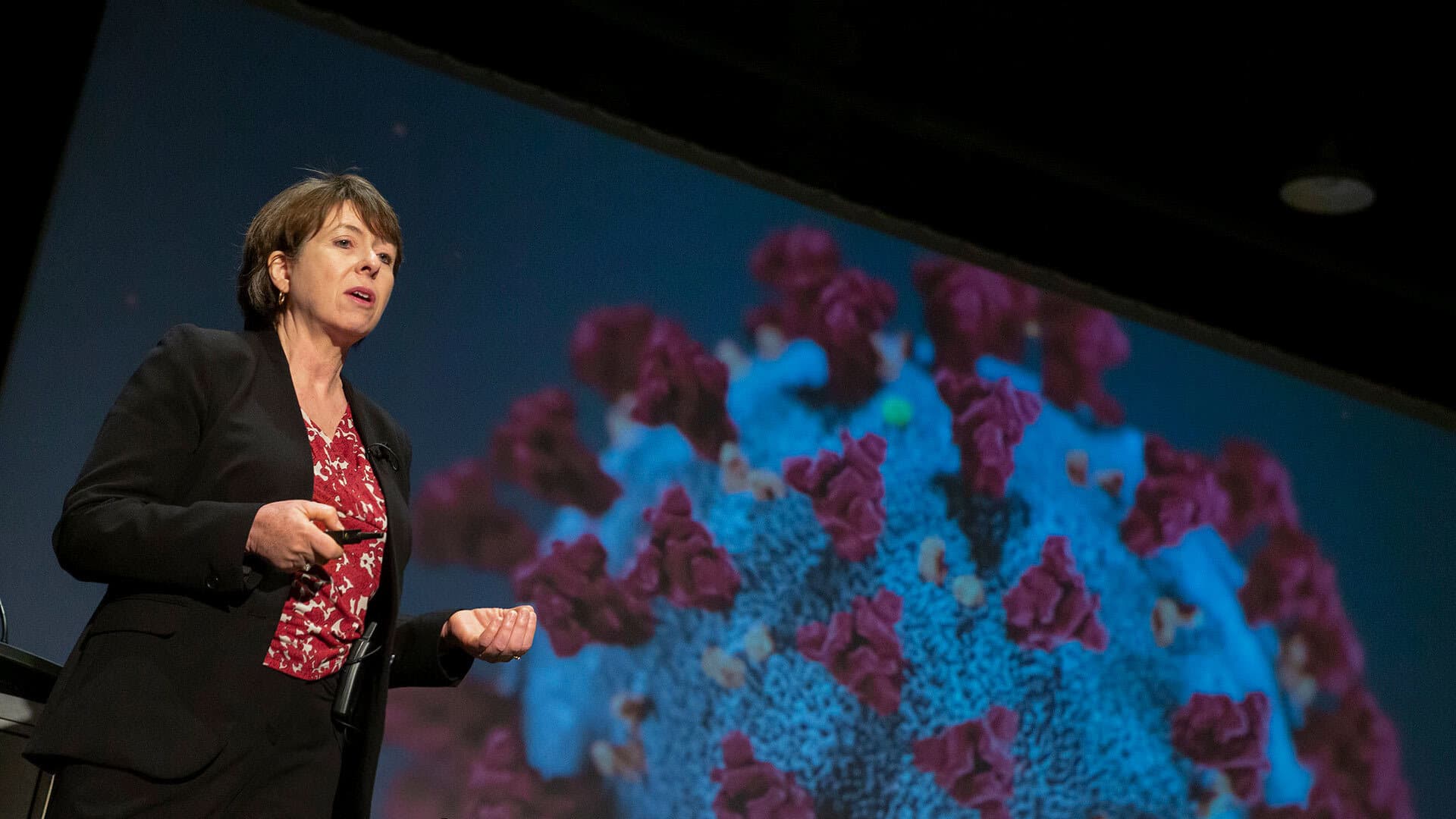 Cynthia Baur speaks at a symposium about coronavirus