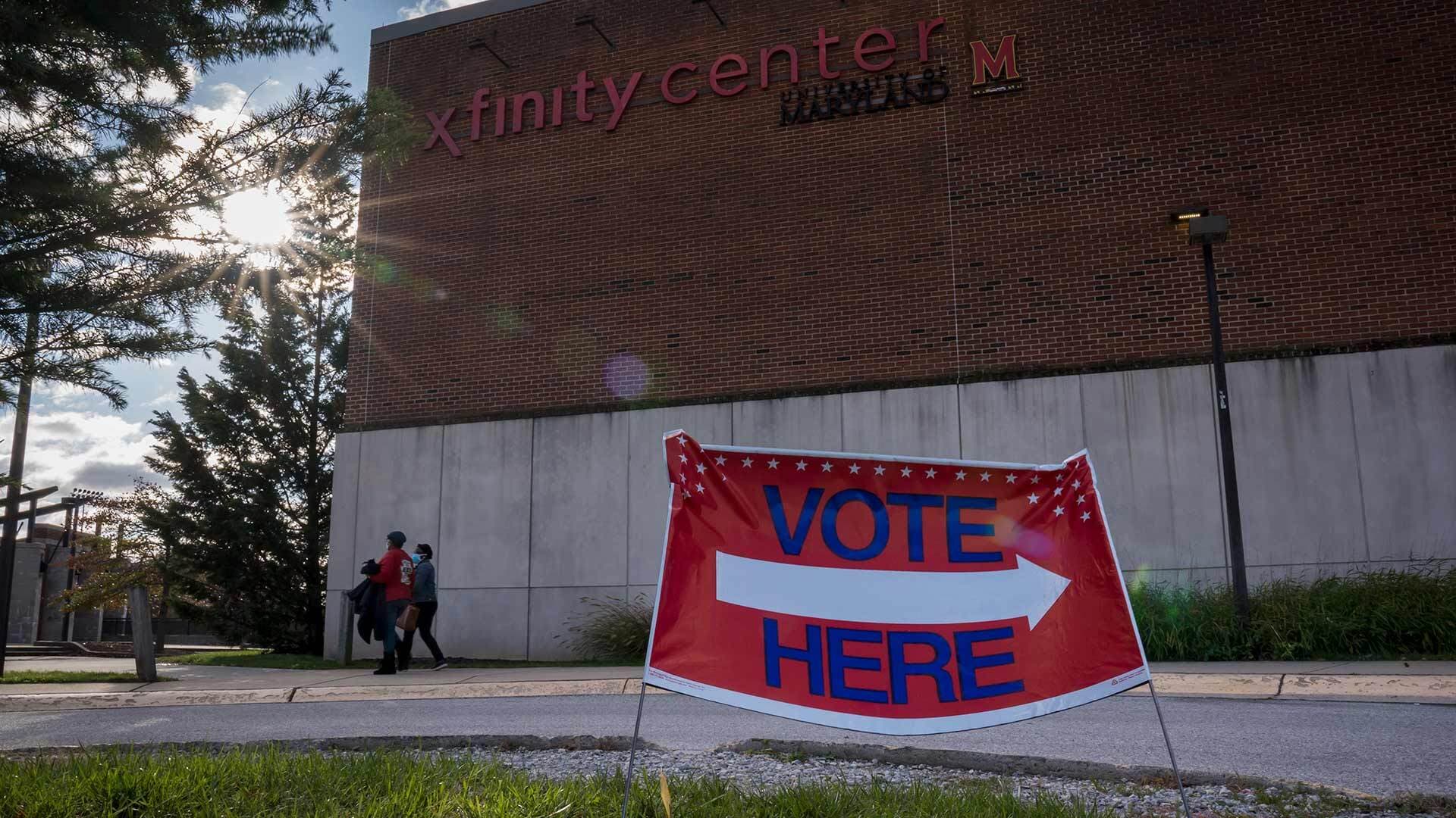 Sign outside Xfinity Center reading "VOTE HERE"