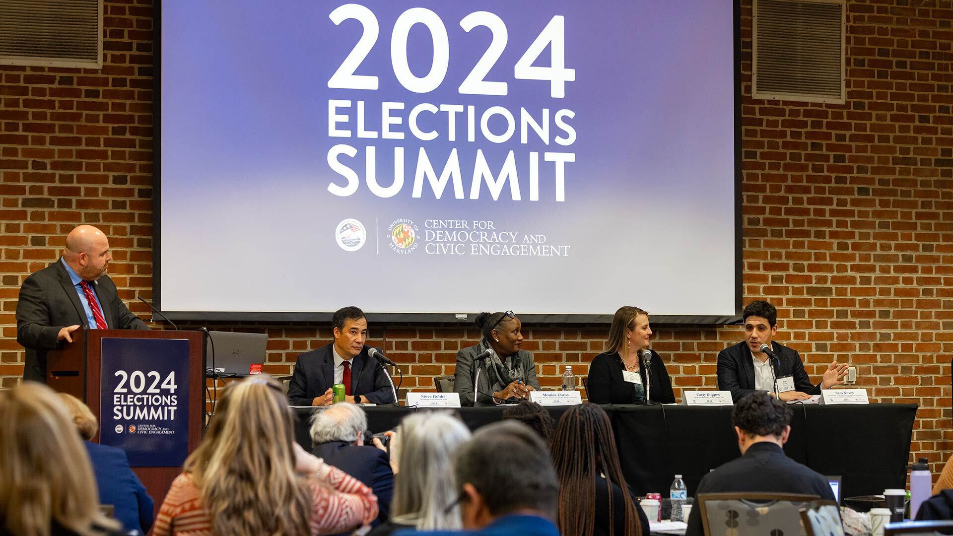 panelists speak on stage at 2024 Elections Summit