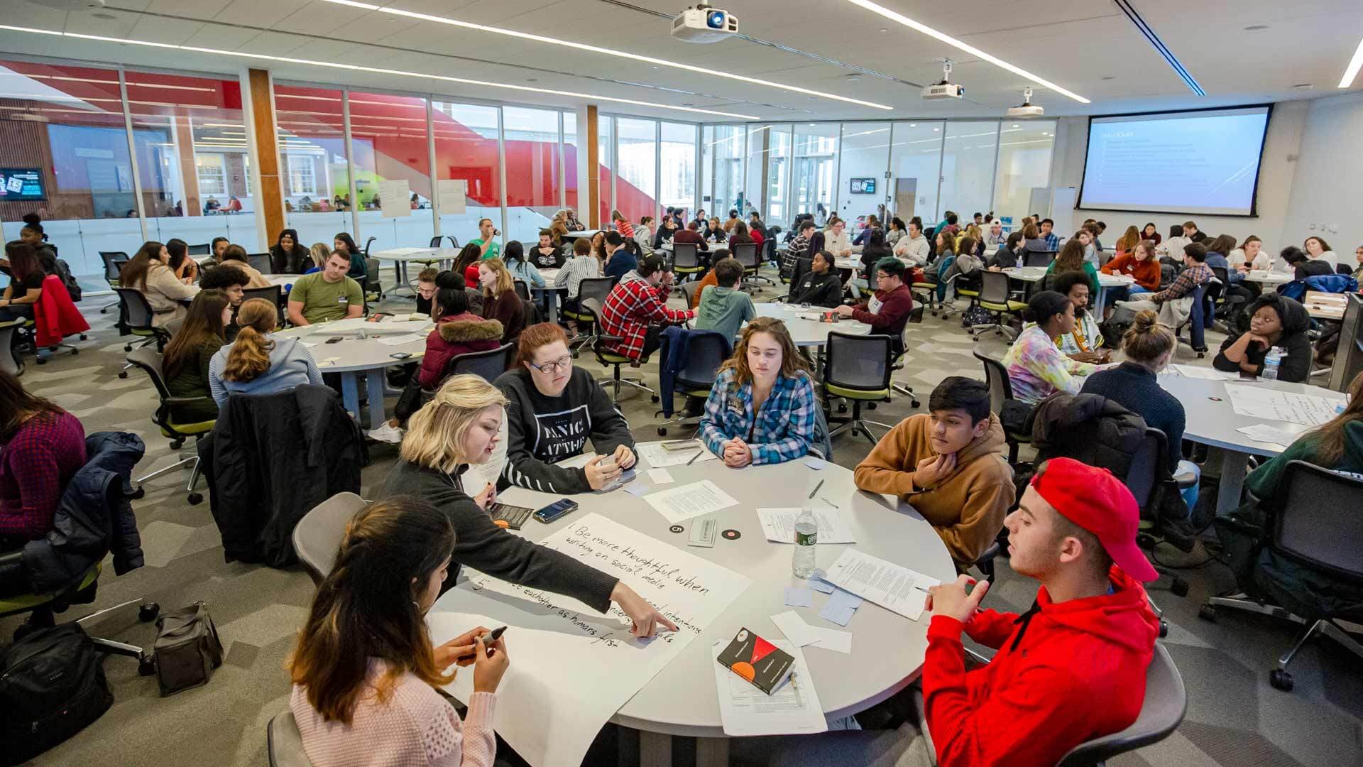 Students sit at round tables in 6Round TERP Classroom