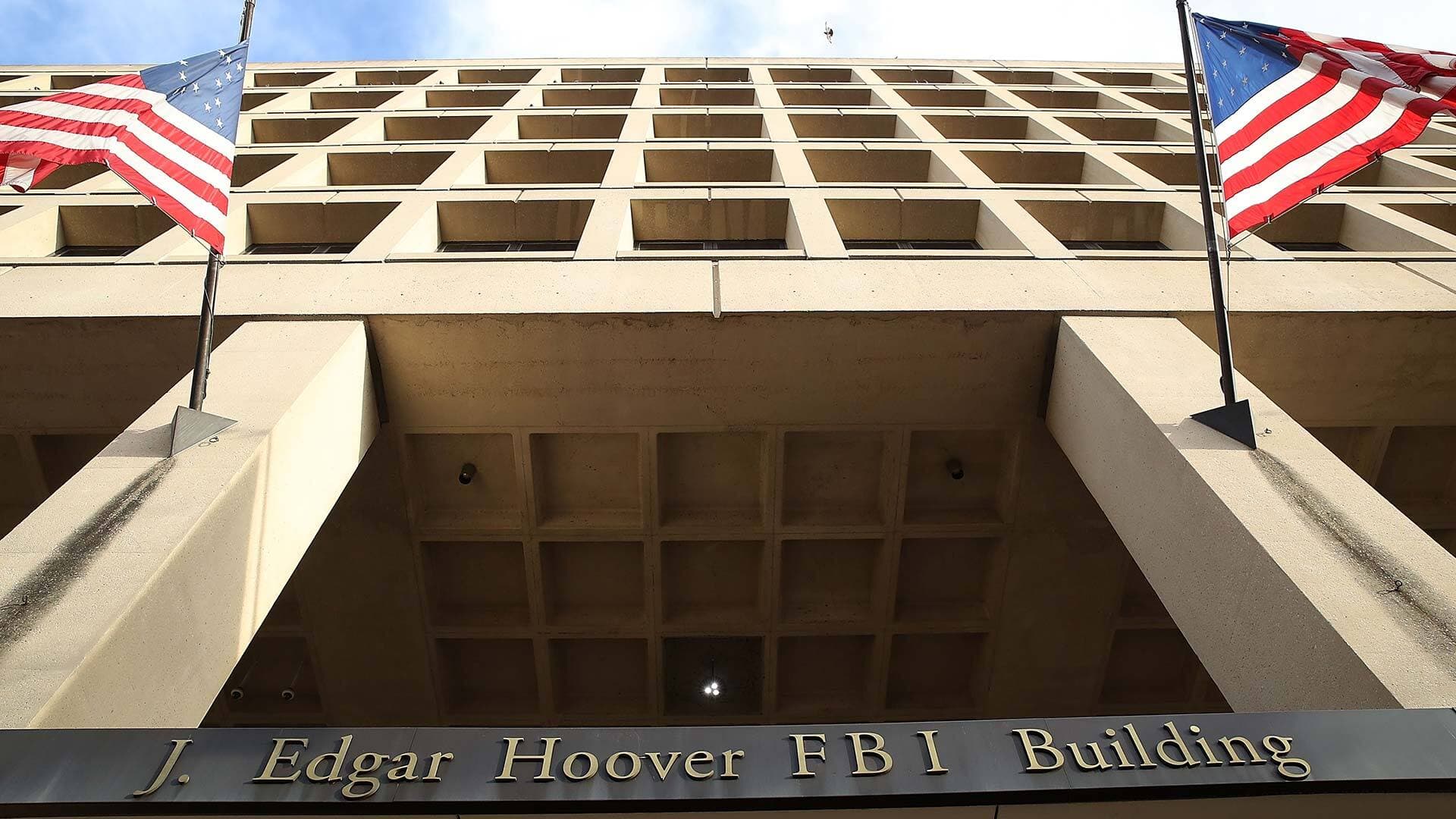 The J. Edgar Hoover FBI Building with American flags flying