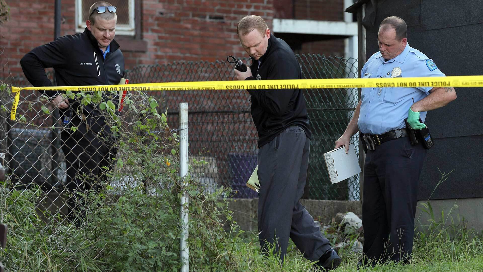 Police investigate the scene of a shooting