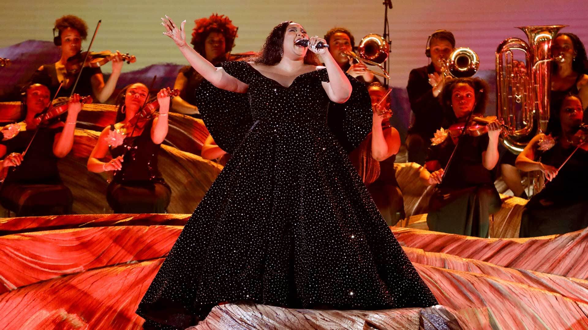 Chelsey Green (seated second from right, front row) plays her viola in support of Lizzo, whose performance opened the Jan. 26 Grammy Awards broadcast.