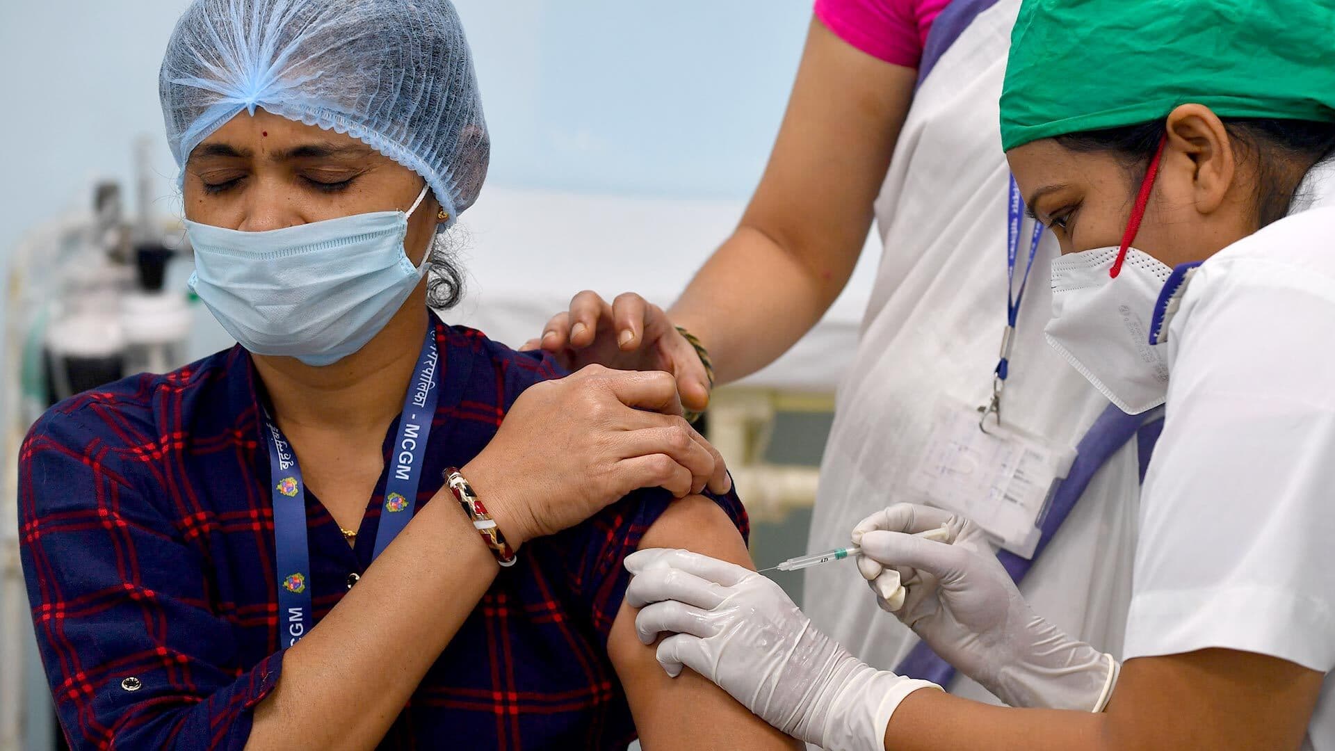 A medical worker inoculates a colleague with a Covid-19 coronavirus vaccine at the Rajawadi Hospital in Mumbai.