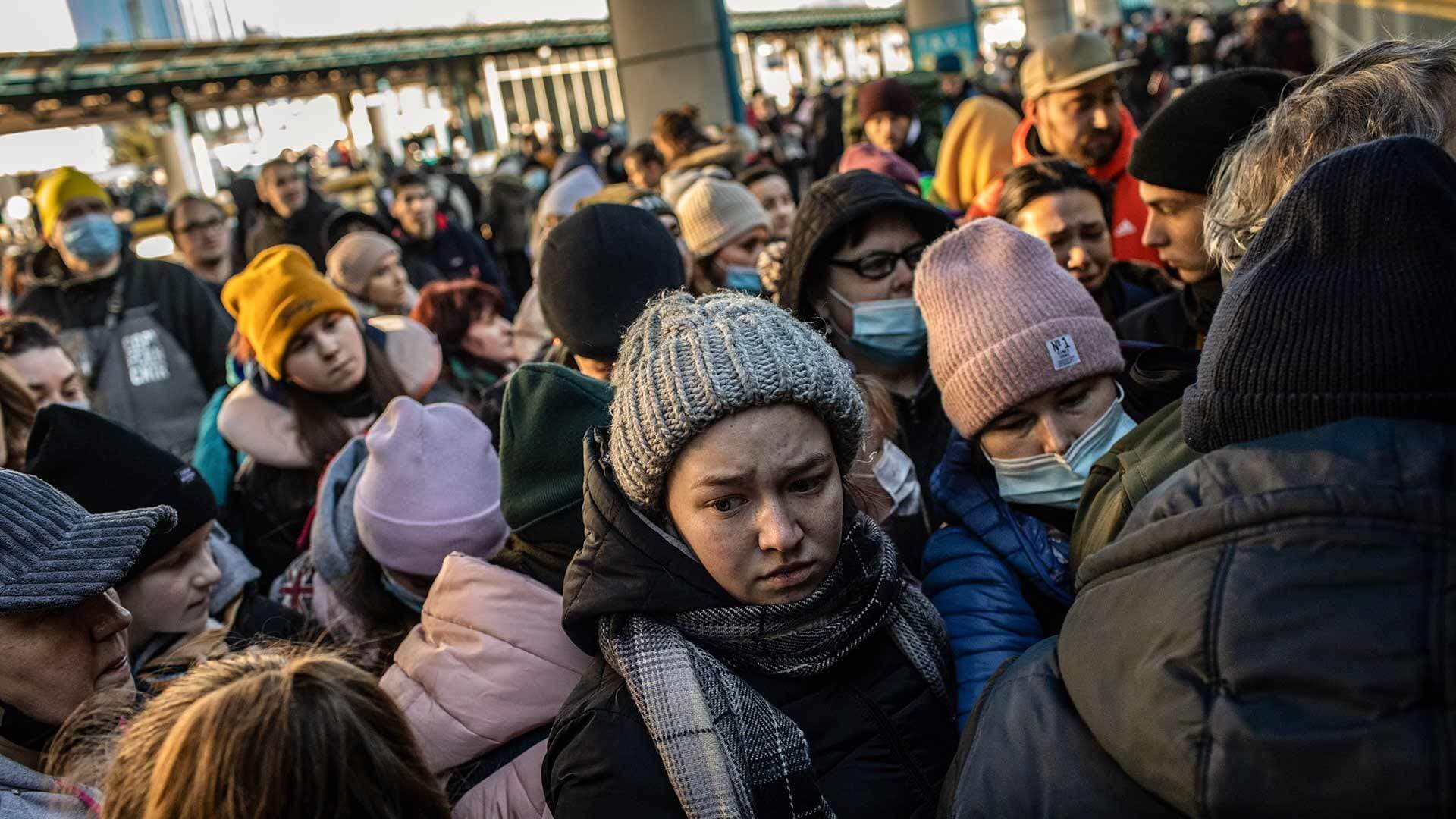 Displaced Ukrainians board a train at Kyiv central train station