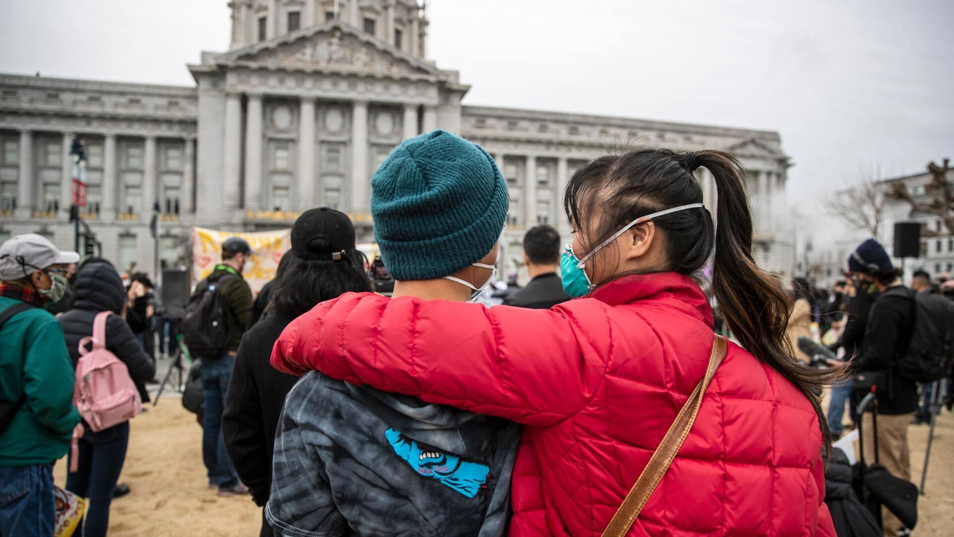 Natalie Choi, 18, embraces her younger brother, Aidan, at a San Francisco rally
