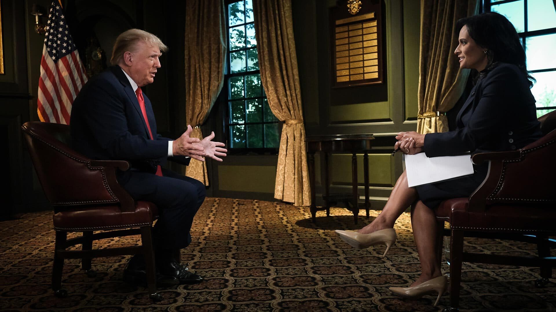Donald Trump sits opposite from a female reporter