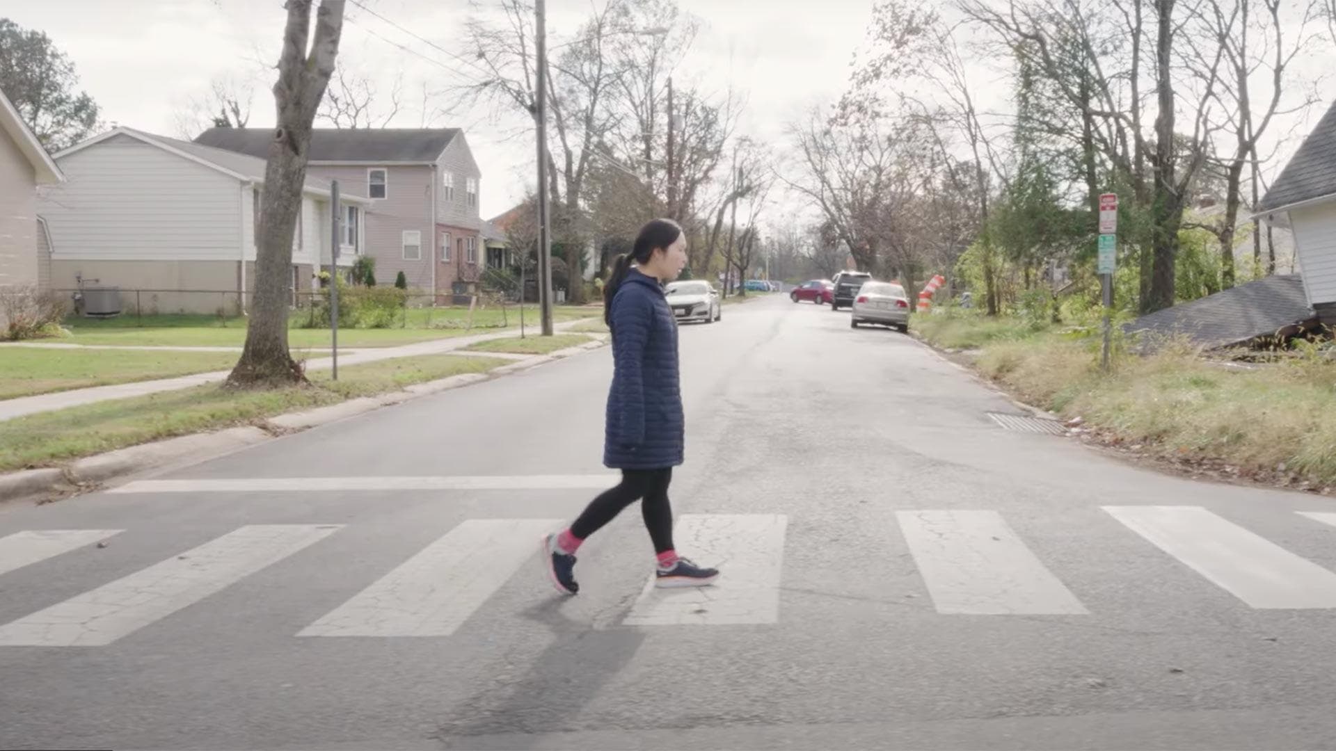 Quynh Nguyen walks in crosswalk