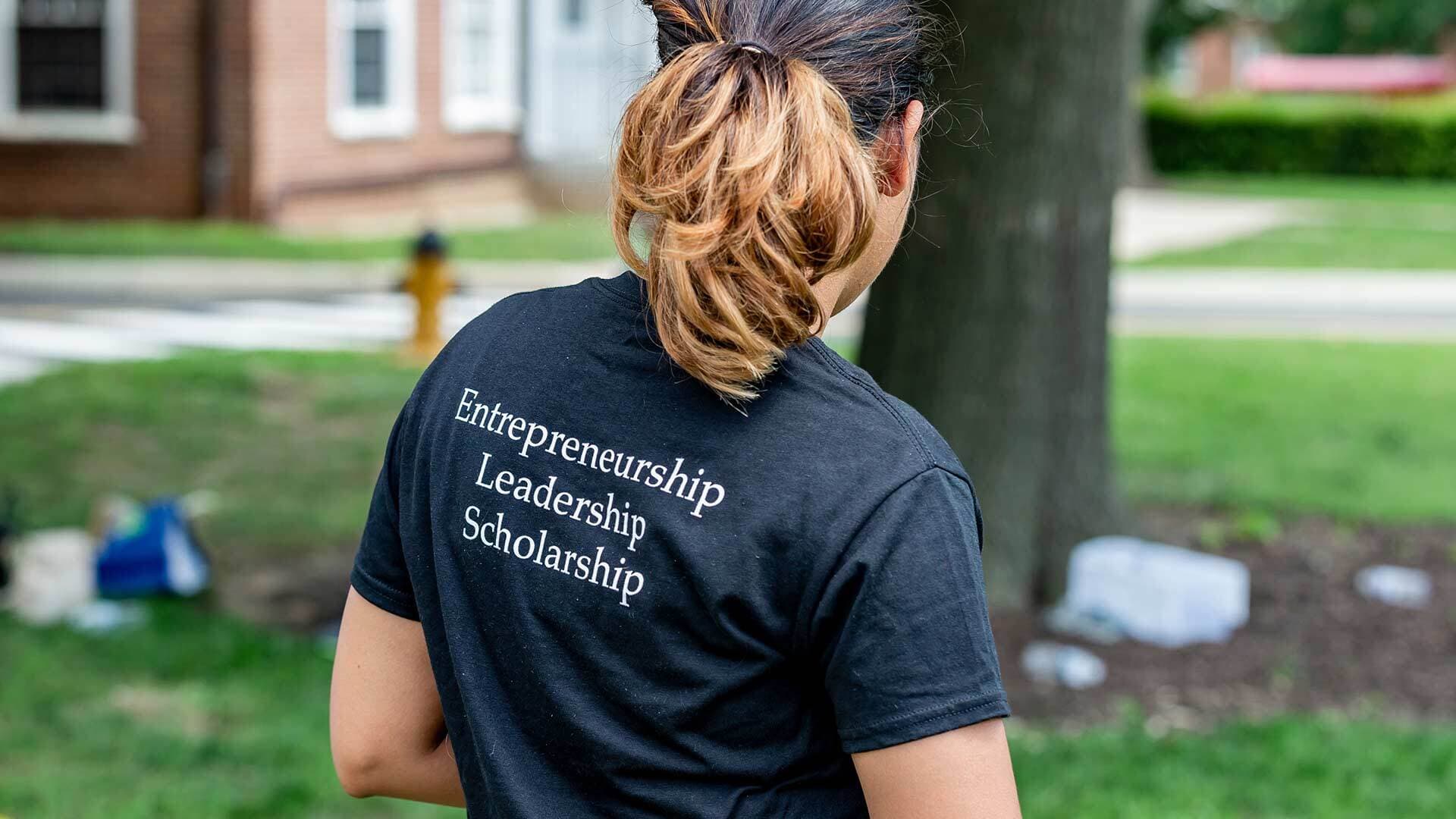 Black T-shirt that reads, "Entrepreneurship, Leadership, Scholarship" on the back