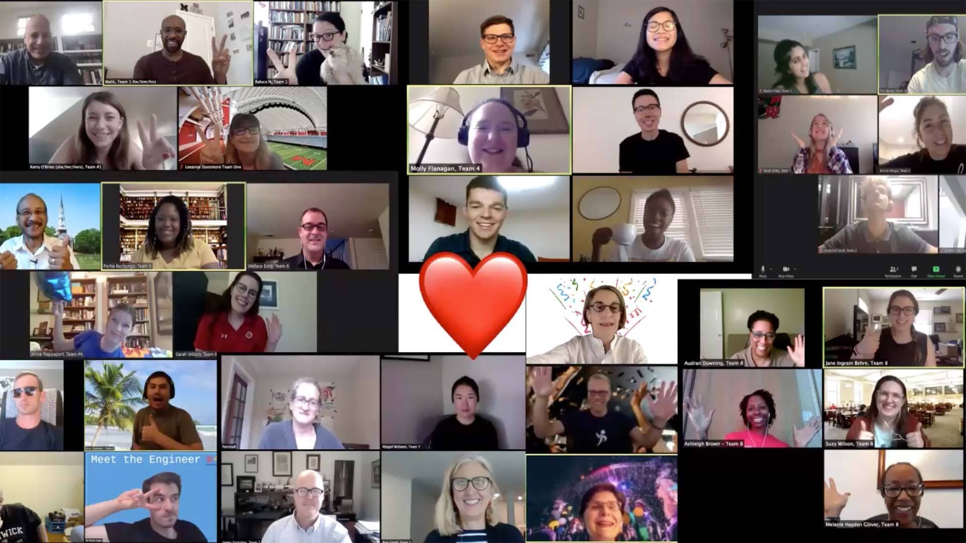 Screengrab of participants on Zoom with a red emoji heart in the middle of the screen