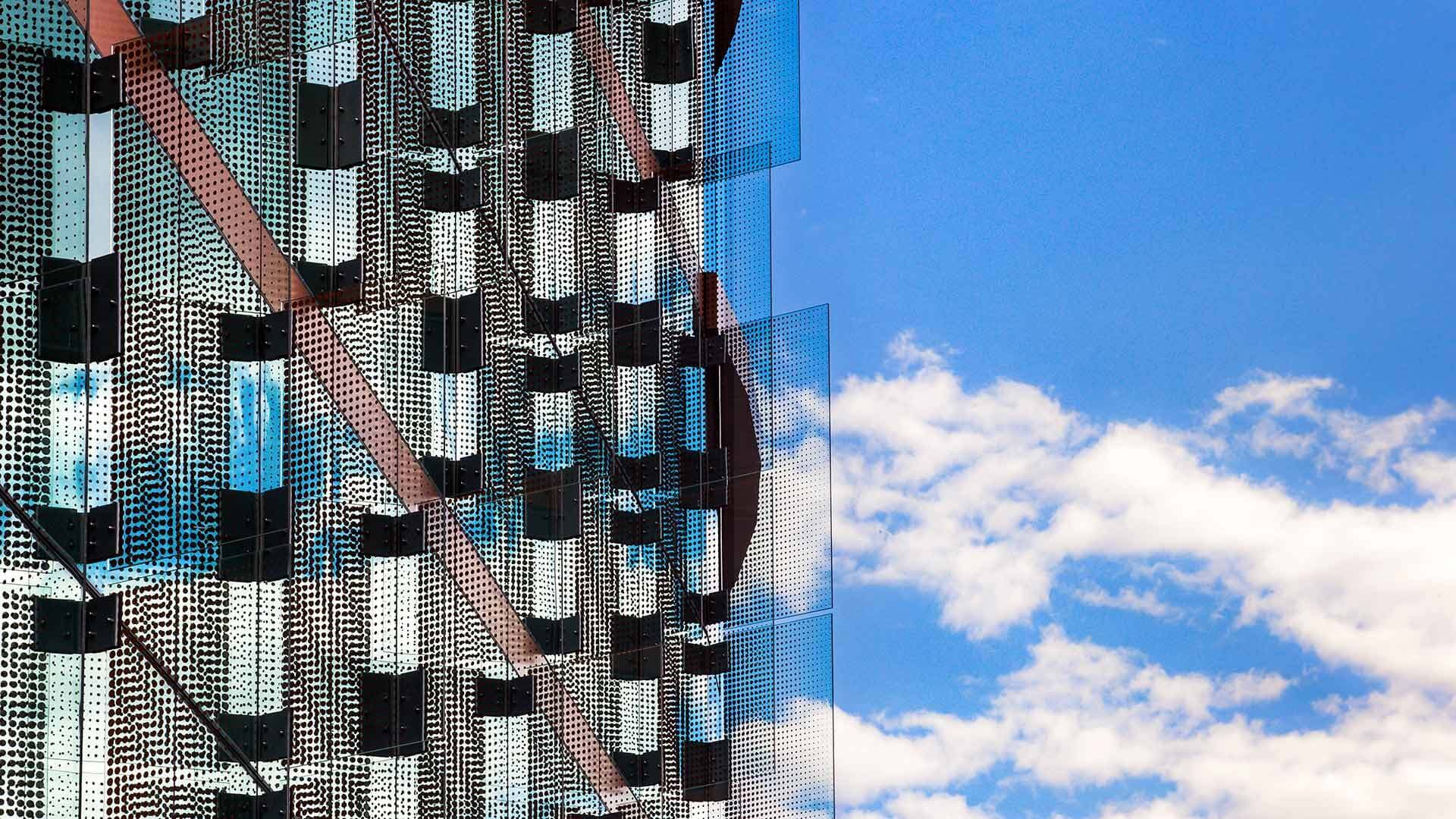 Windows at the Iribe Center against a blue sky