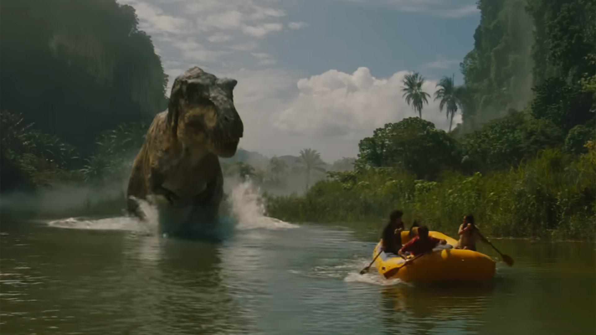 T. rex chases people in a raft in a movie still from "Jurassic World Rebirth"