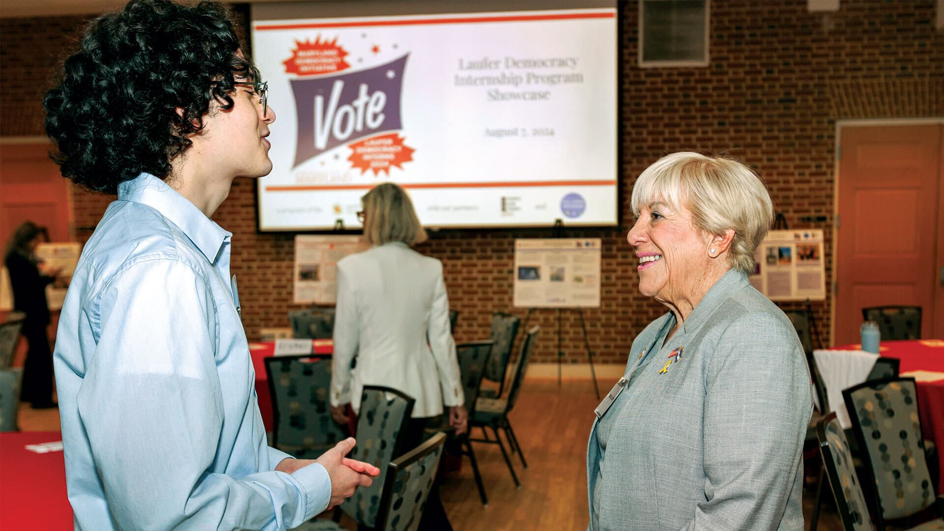 Marsha Laufer talks to student in the Stamp