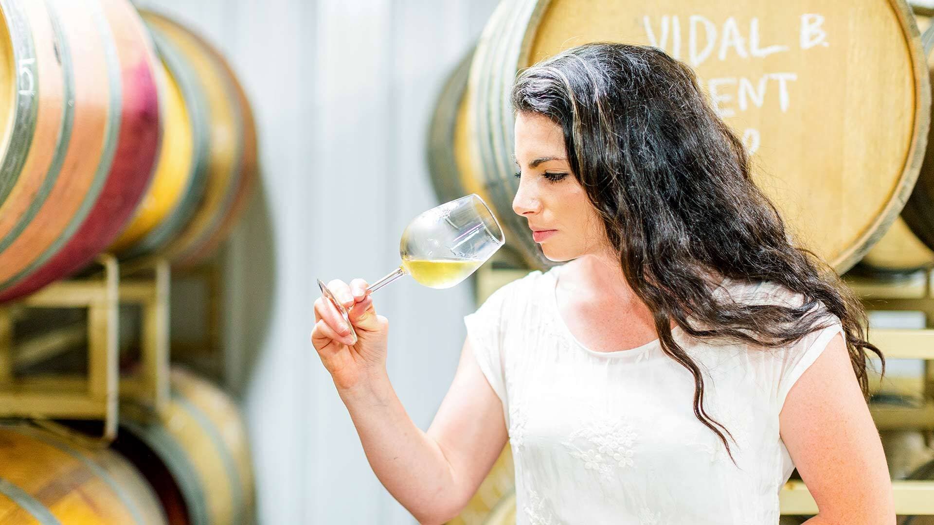 Rachel Loew-Lipman '15 smelling glass of wine