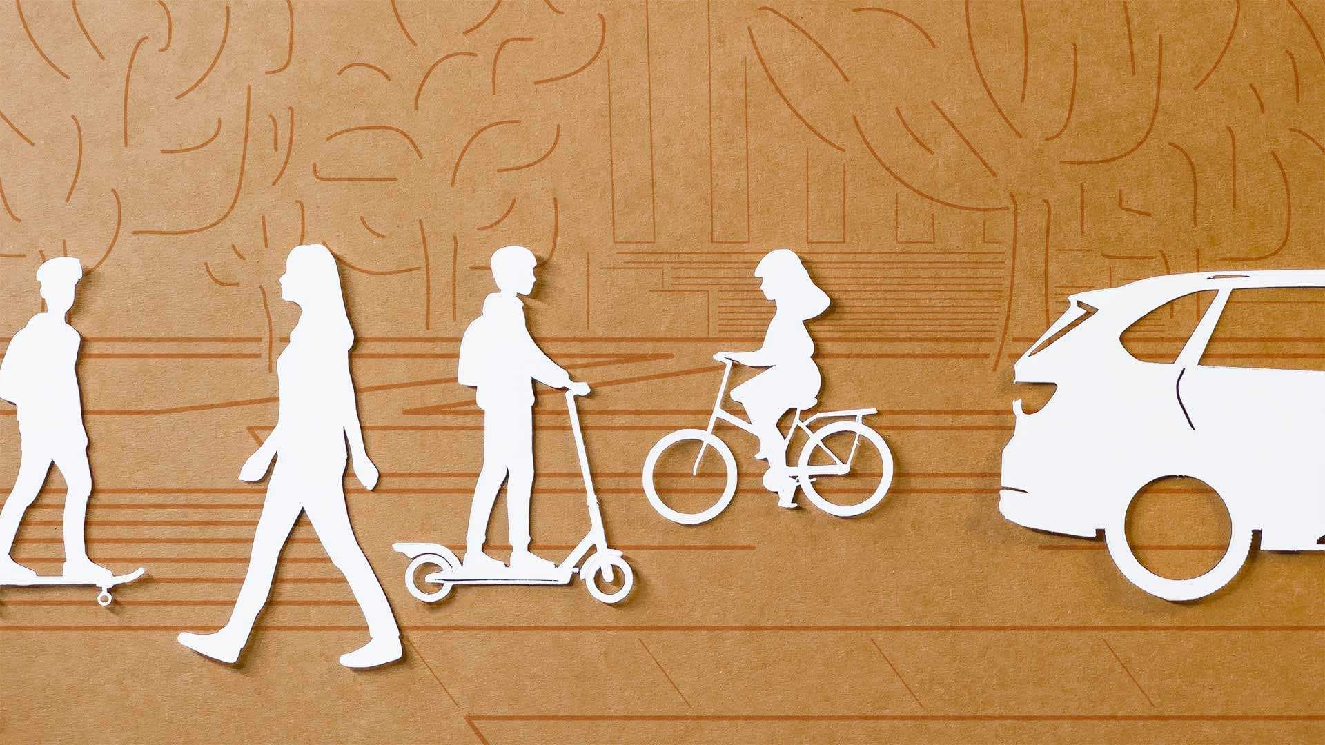 paper cutouts of people riding a skateboard, walking, riding a scooter, riding a bike, and a car