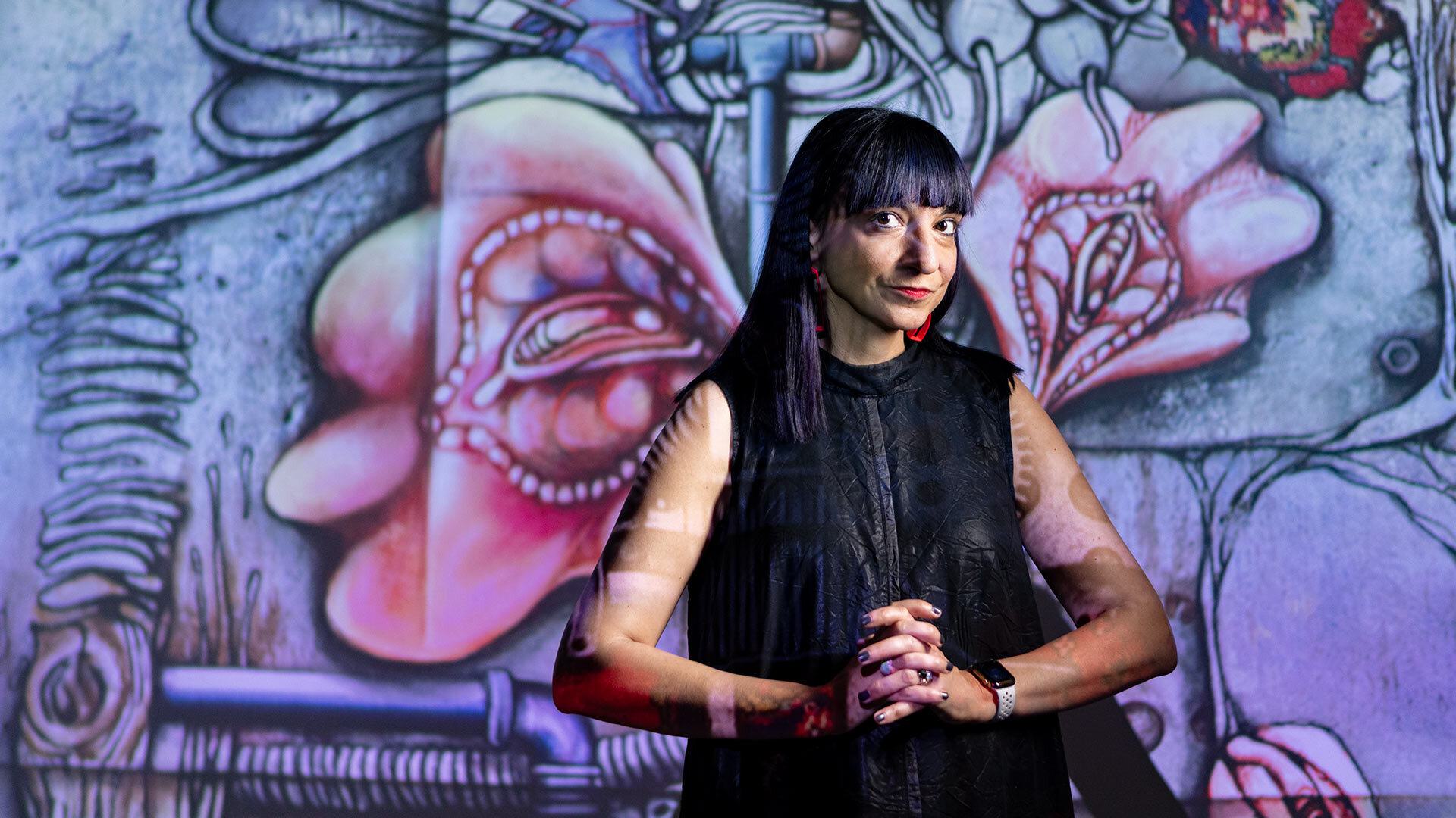 portrait of Neda Atanasoski against painted backdrop