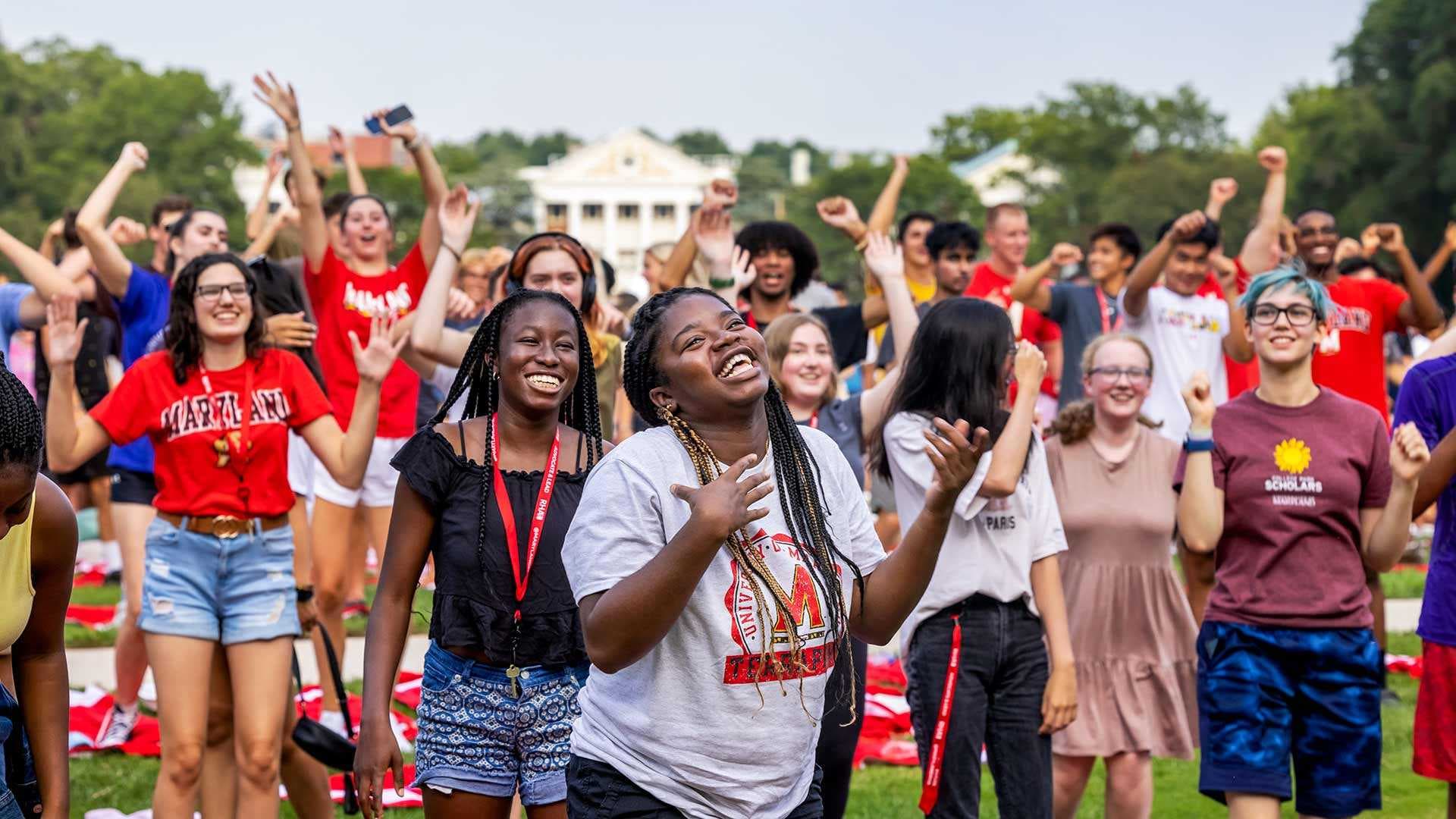 students pose for photo on McKeldin Mall