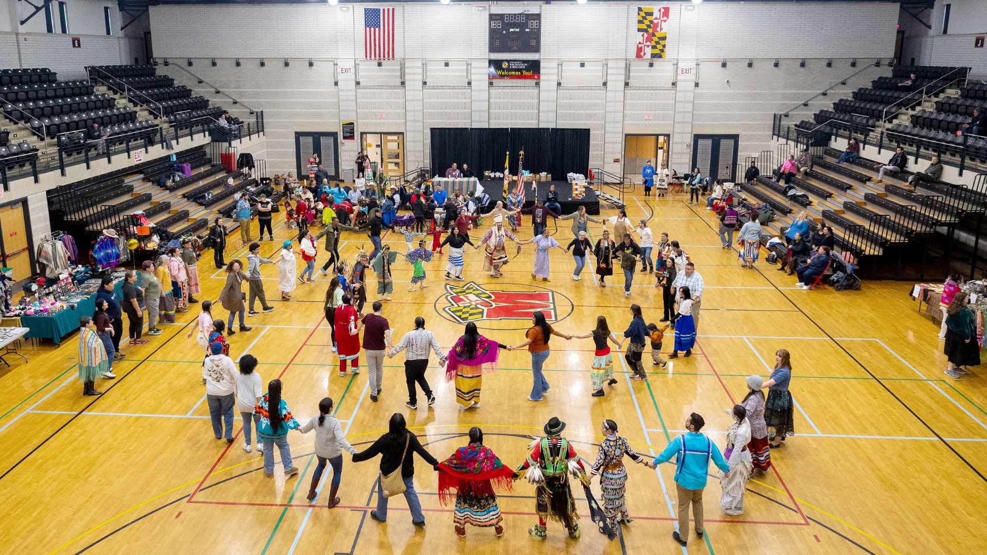 Pow wow attendees do  a round dance