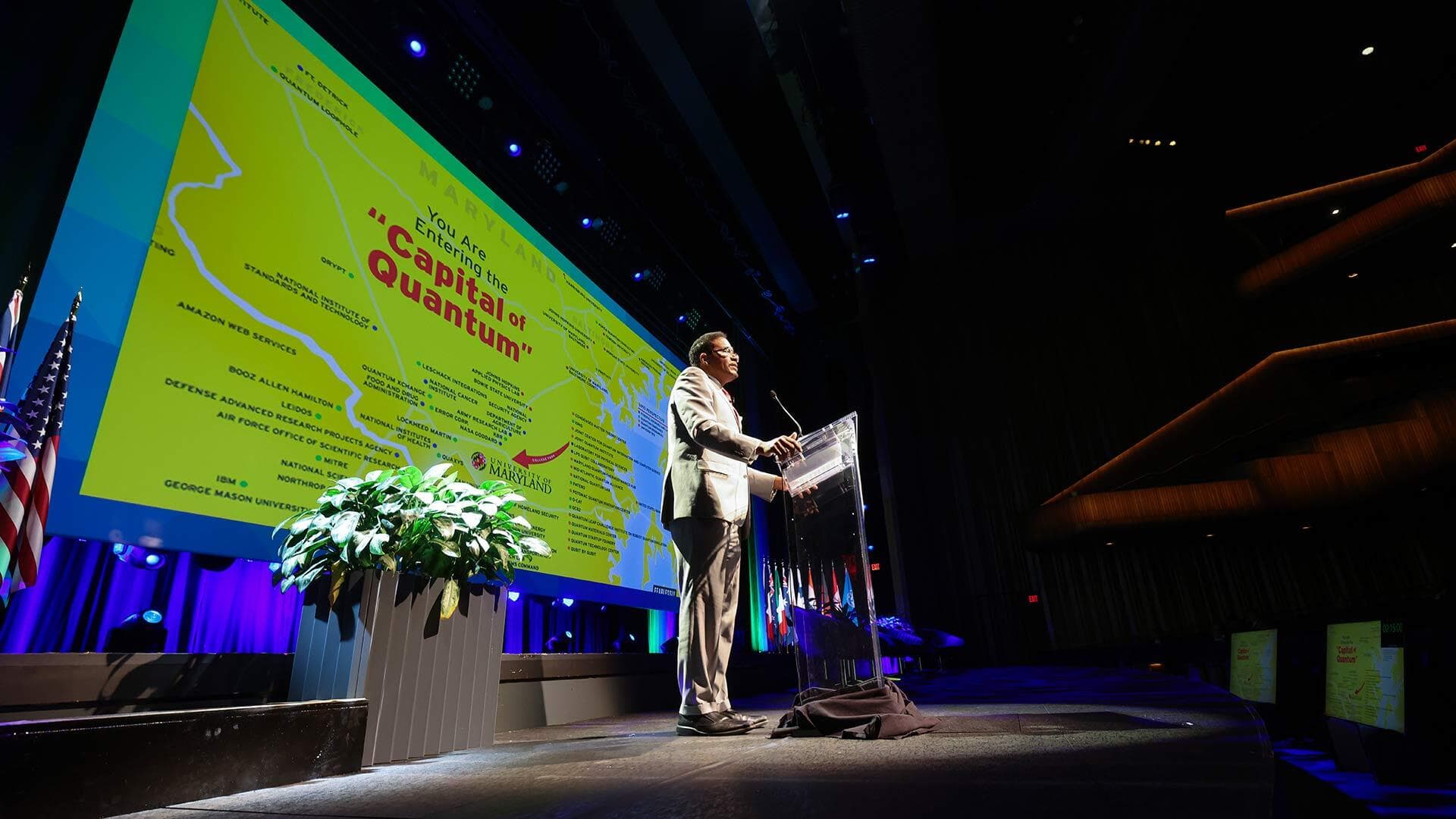 Darryll Pines speaks to audience on stage