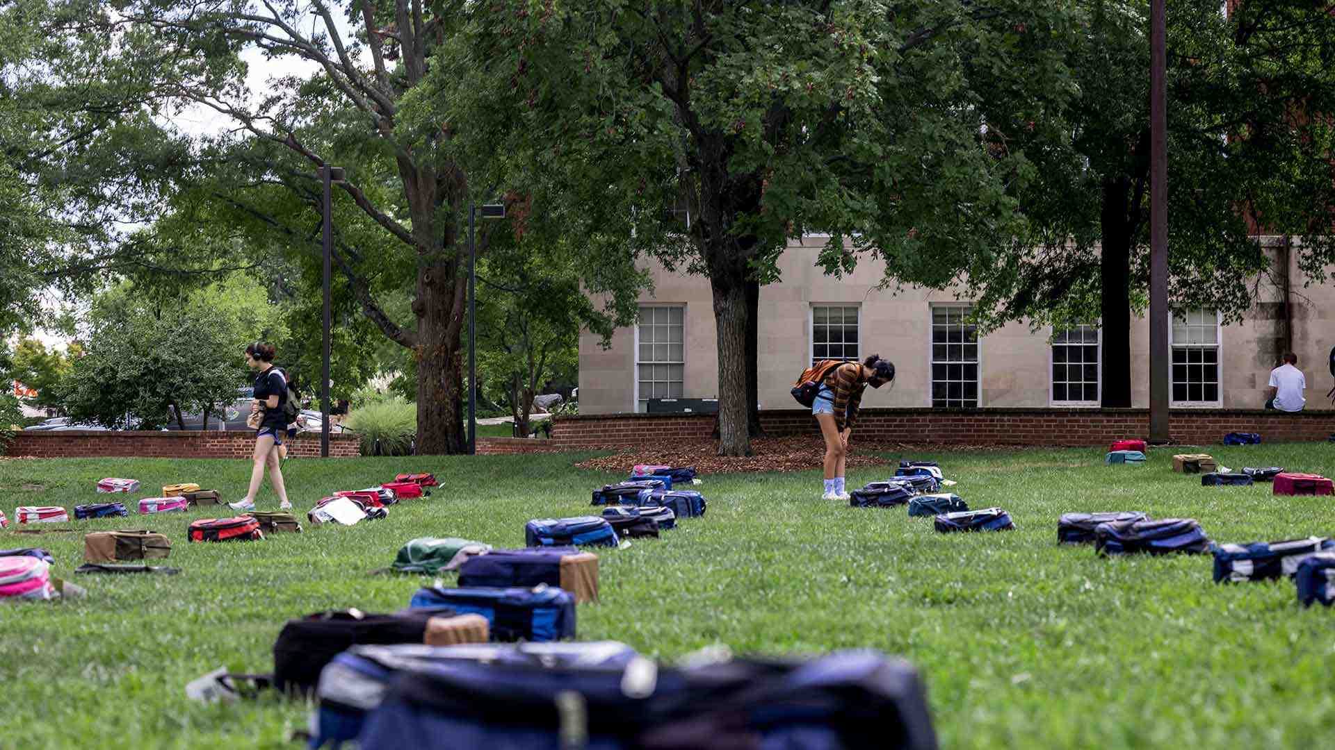 Students and backpacks on McKeldin Mall during Send Silence Packing event