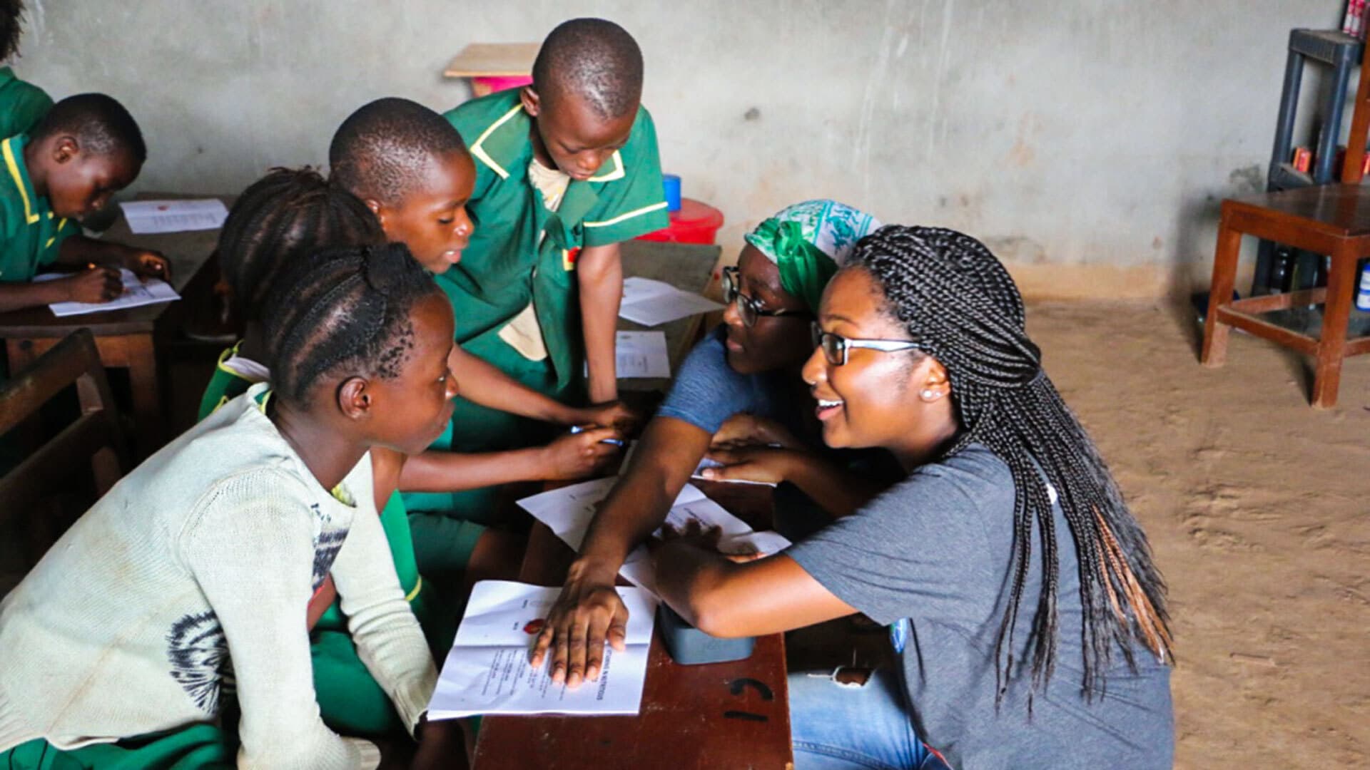 Kelsie Challenger interacts with students at the Abigail D. Butscher School in Calaba Town, Sierra Leone
