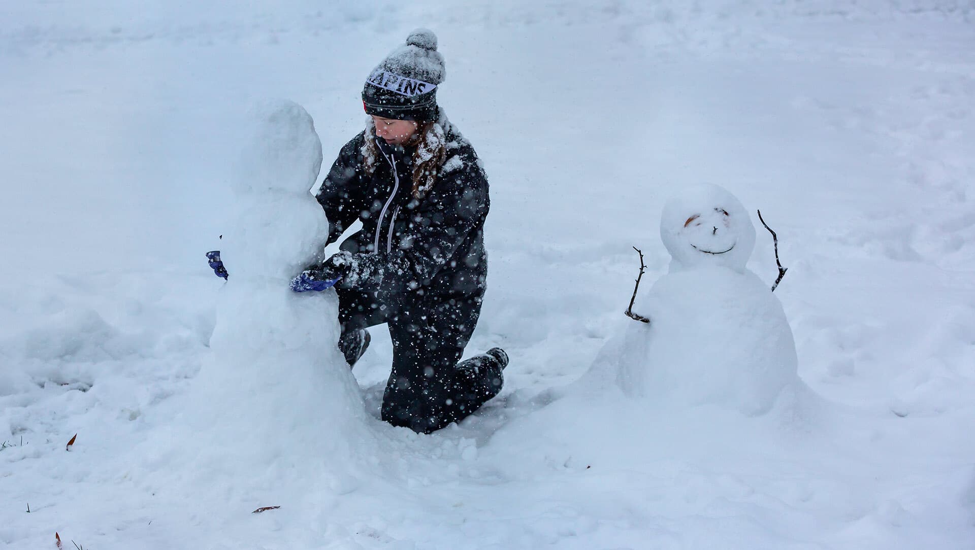 Student making snowman