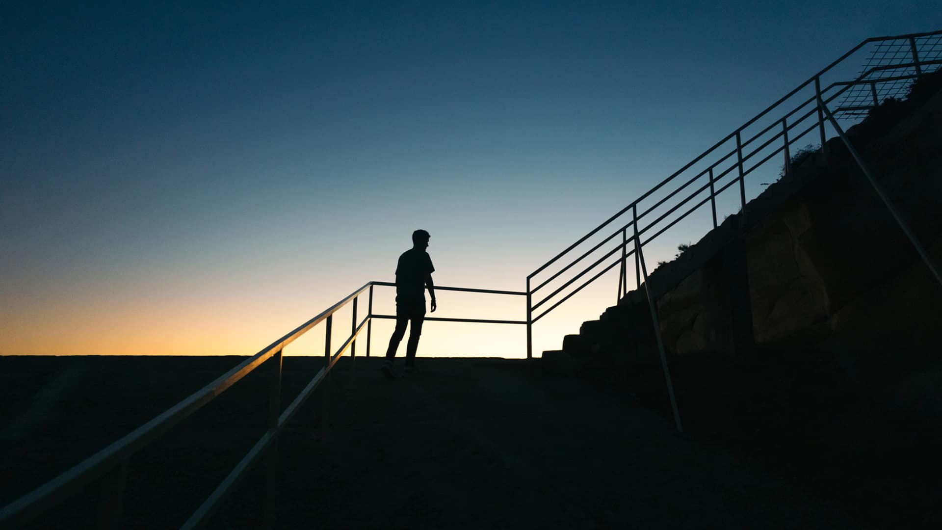 silhouette of man on stairs