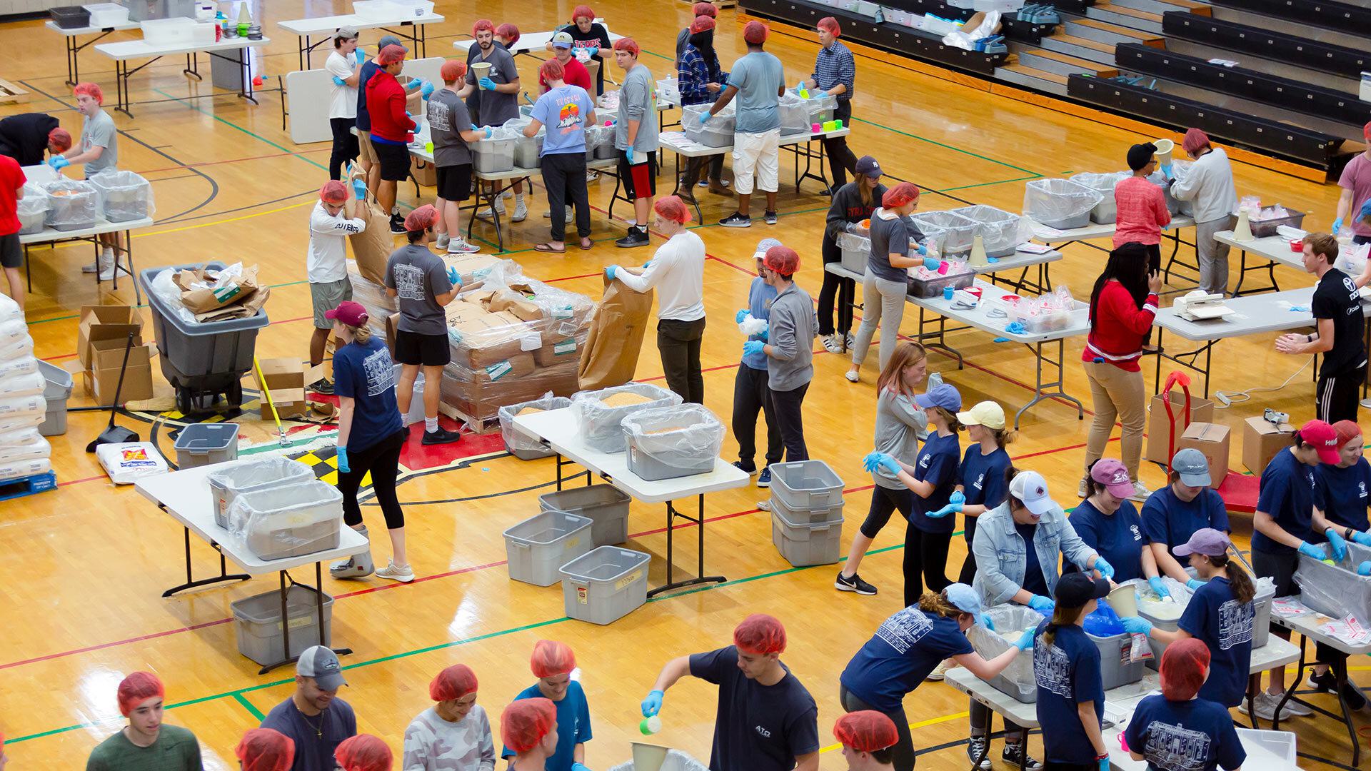students package food at Terps Against Hunger event