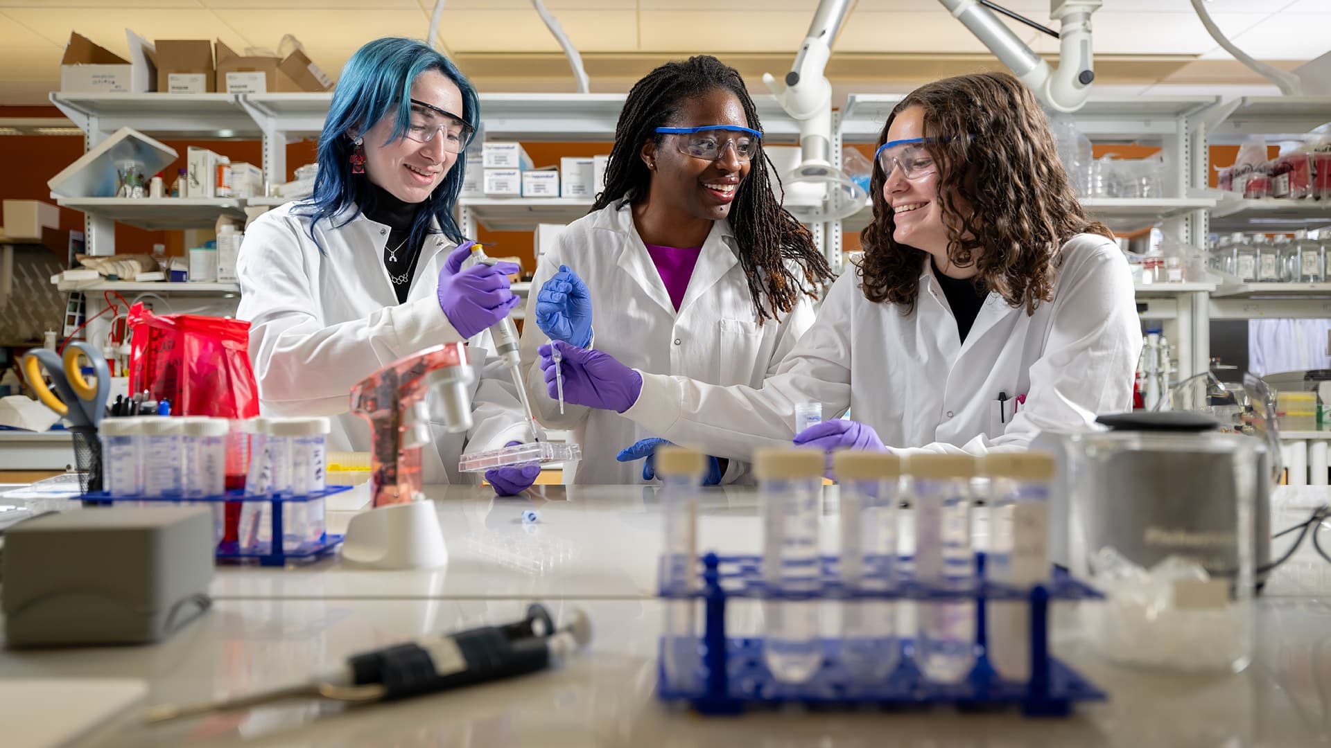 three women work in lab