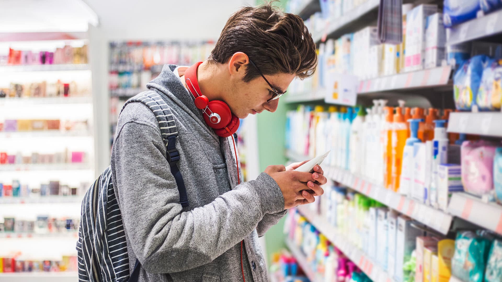 Young man purchasing skin product