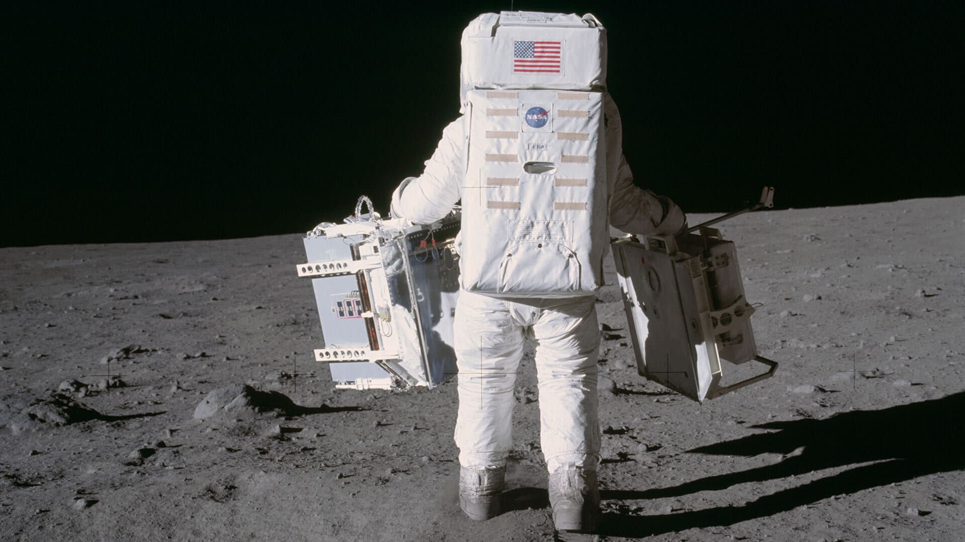 Astronaut carrying moon mirror