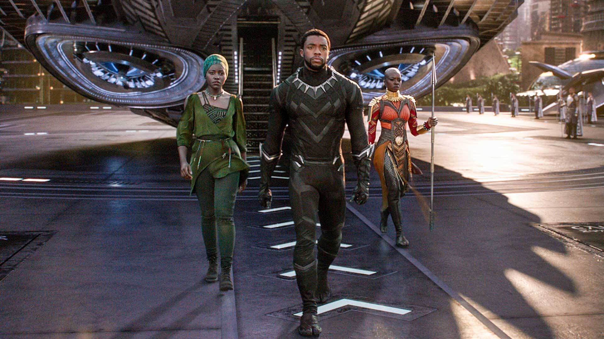 Nakia (Lupita Nyong'o), T'Challa/Black Panther (Chadwick Boseman) and Okoye (Danai Gurira) walk in "Black Panther"