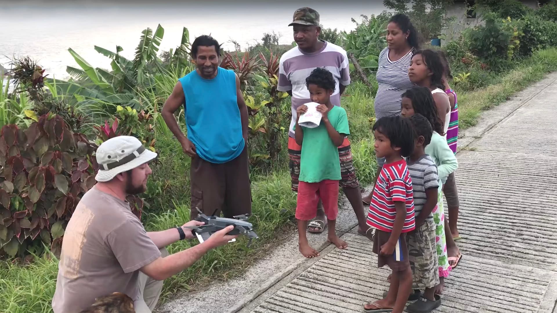 University of Maryland UAS Test Site pilot Ryan Henderson shows residents of Dominica a drone he used in early 2018 to create imagery of damage following Hurricane Maria, which struck the island in 2017.