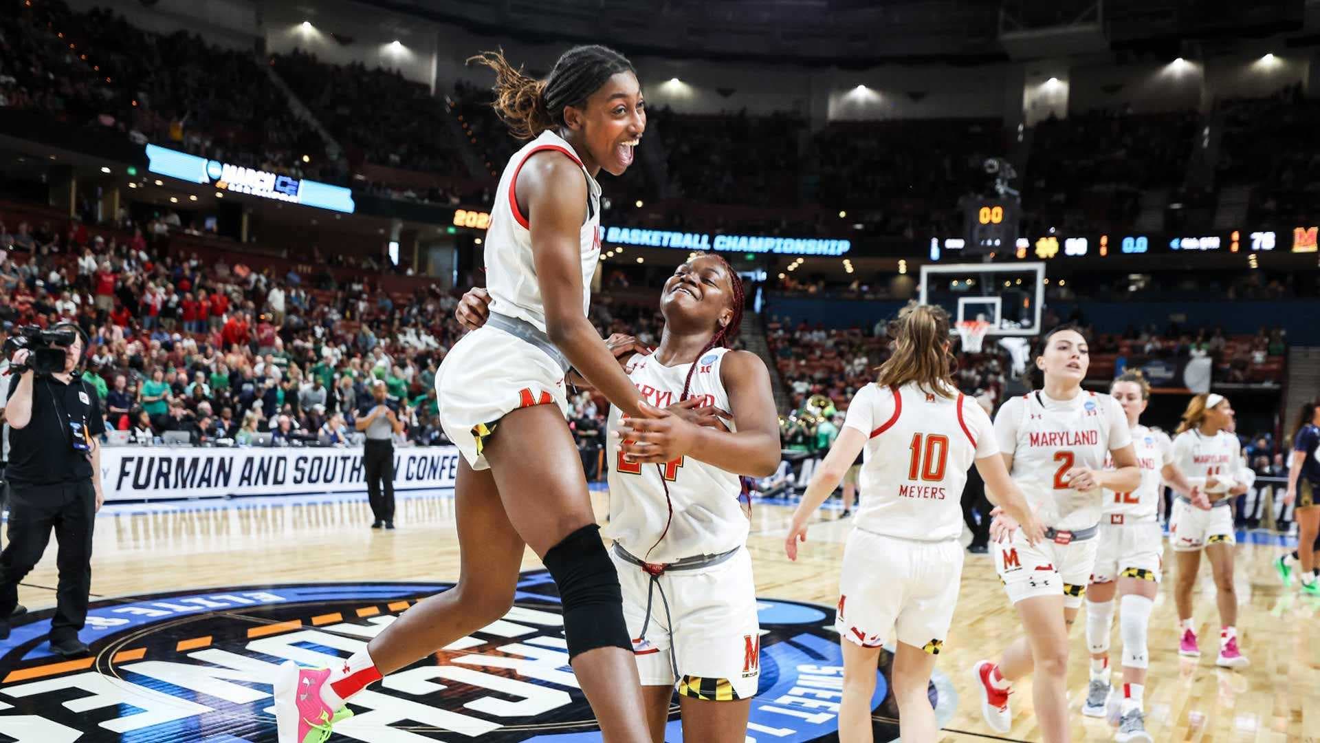 Maryland women's basketball team celebrates on the court