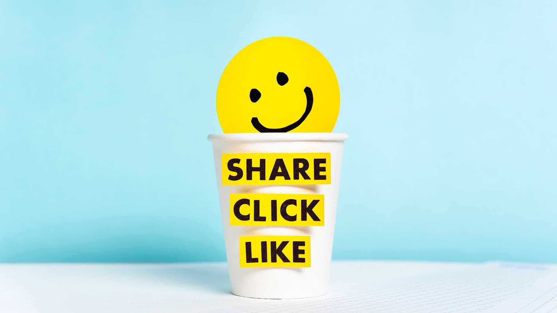 Smiley face with "Share, click, like"