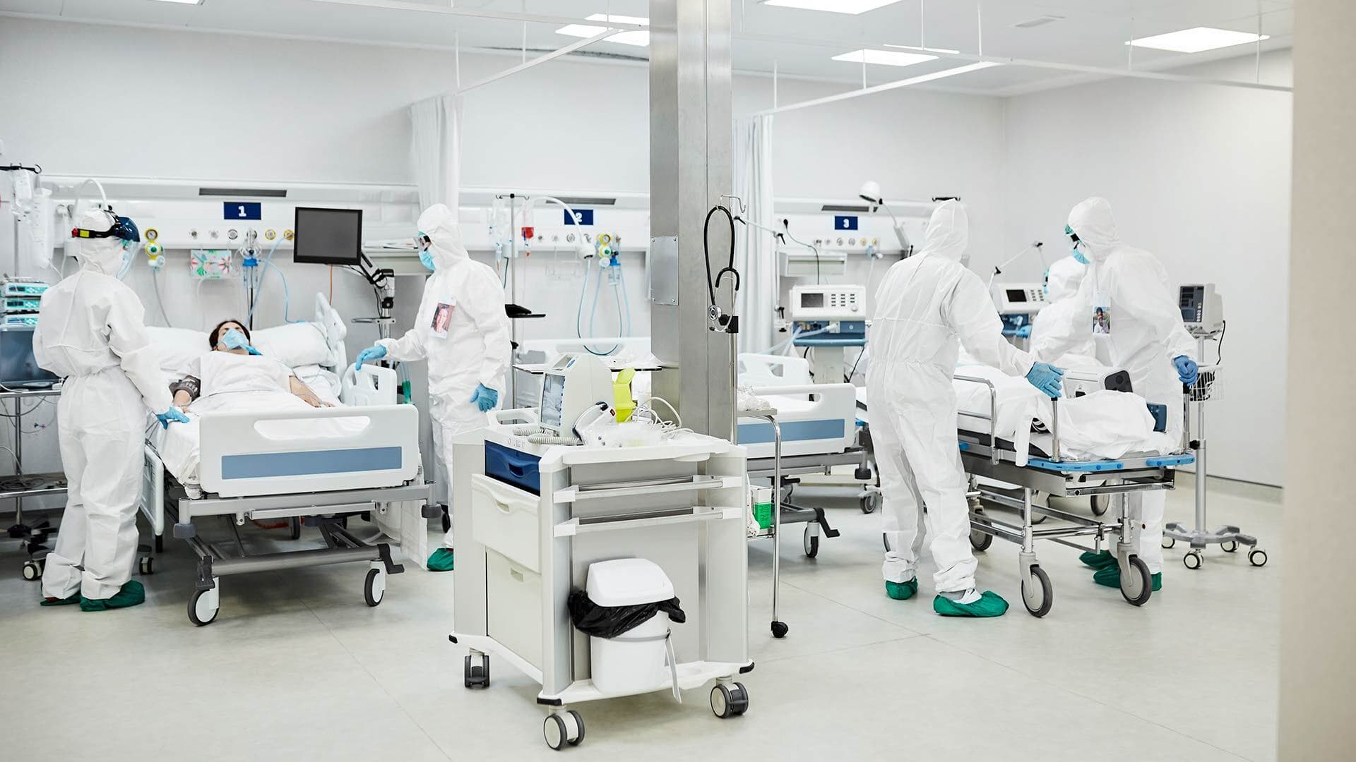 health care workers wear full suits to avoid infenction in ICU