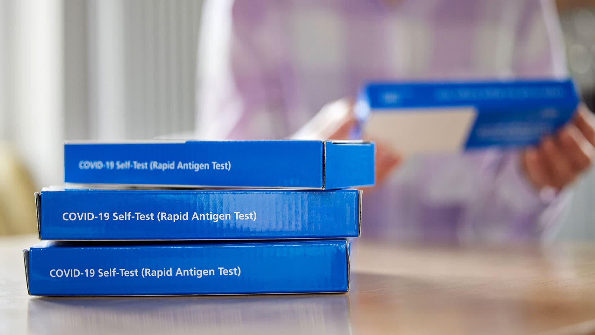 boxes of COVID-19 self-tests (rapid antigen tests)